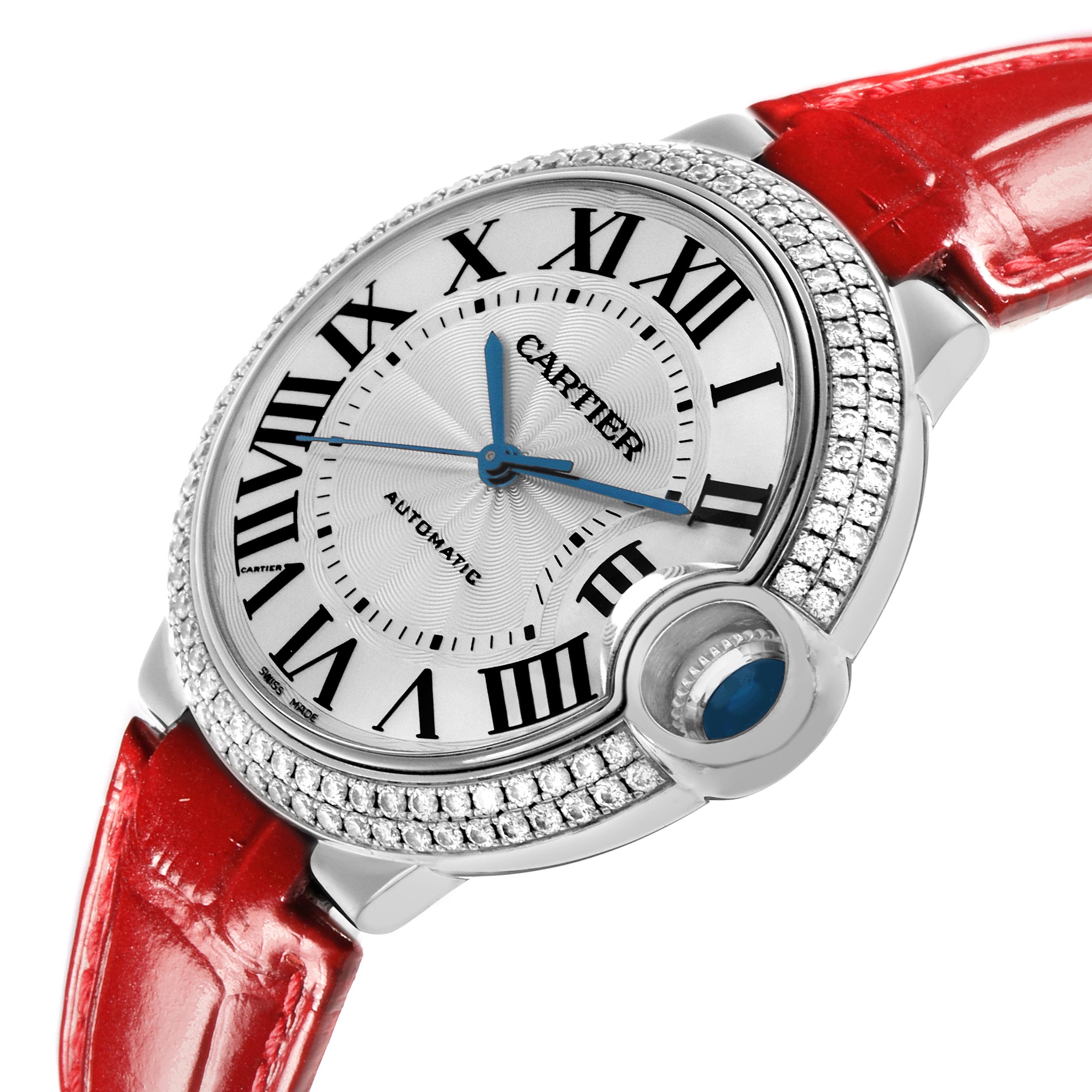 The Cartier Ballon Bleu WE900651 Women
s White Gold Silver Dial WE900651 Women
s White Gold Silver Dial watch is shown at an angled view, highlighting the face, red strap, diamond-set bezel, and crown detail.