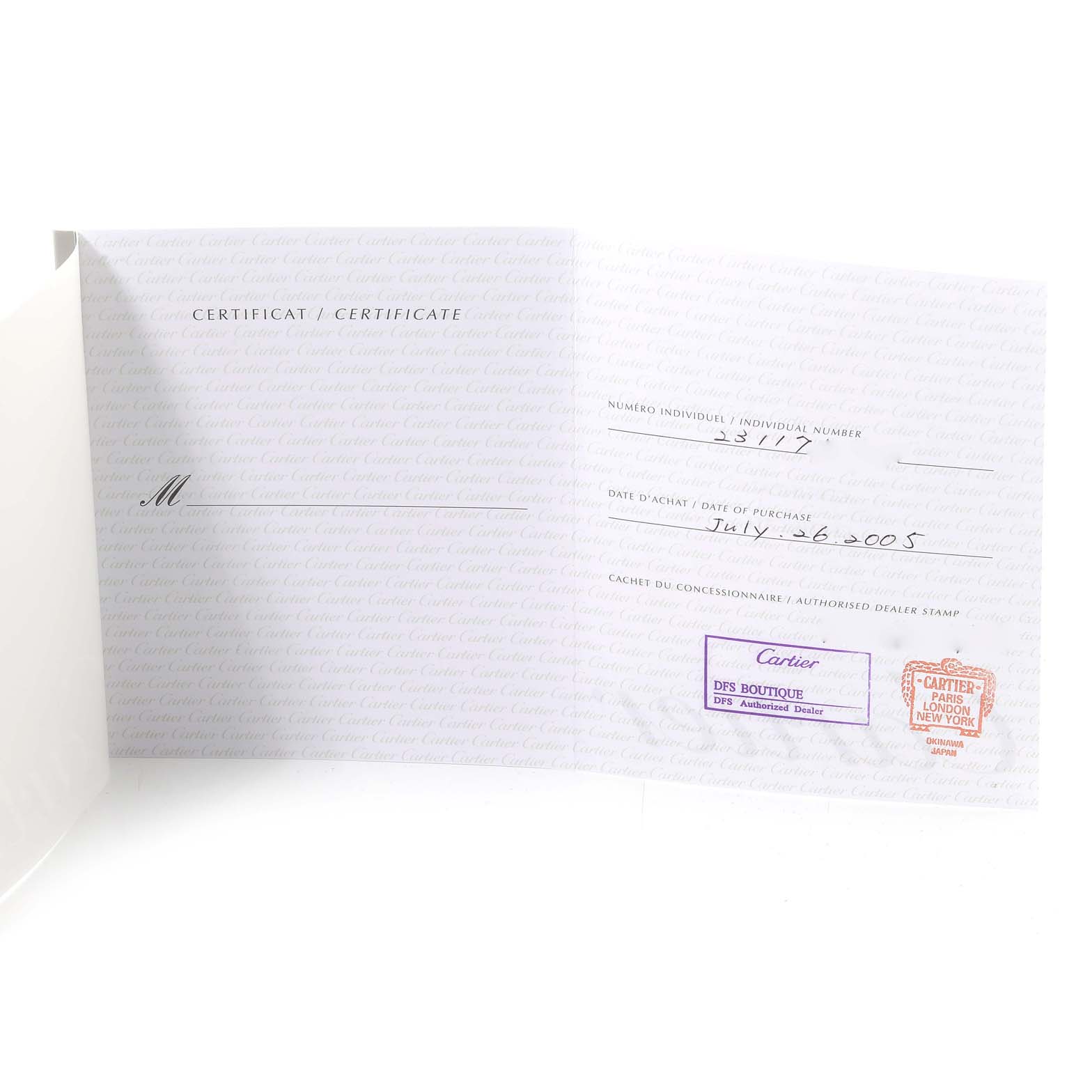 The image shows a certificate for a Cartier Roadster W62025V3 Men's Stainless Steel Silver Dial W62025V3 Men's Stainless Steel Silver Dial watch, featuring purchase details and dealer stamps.