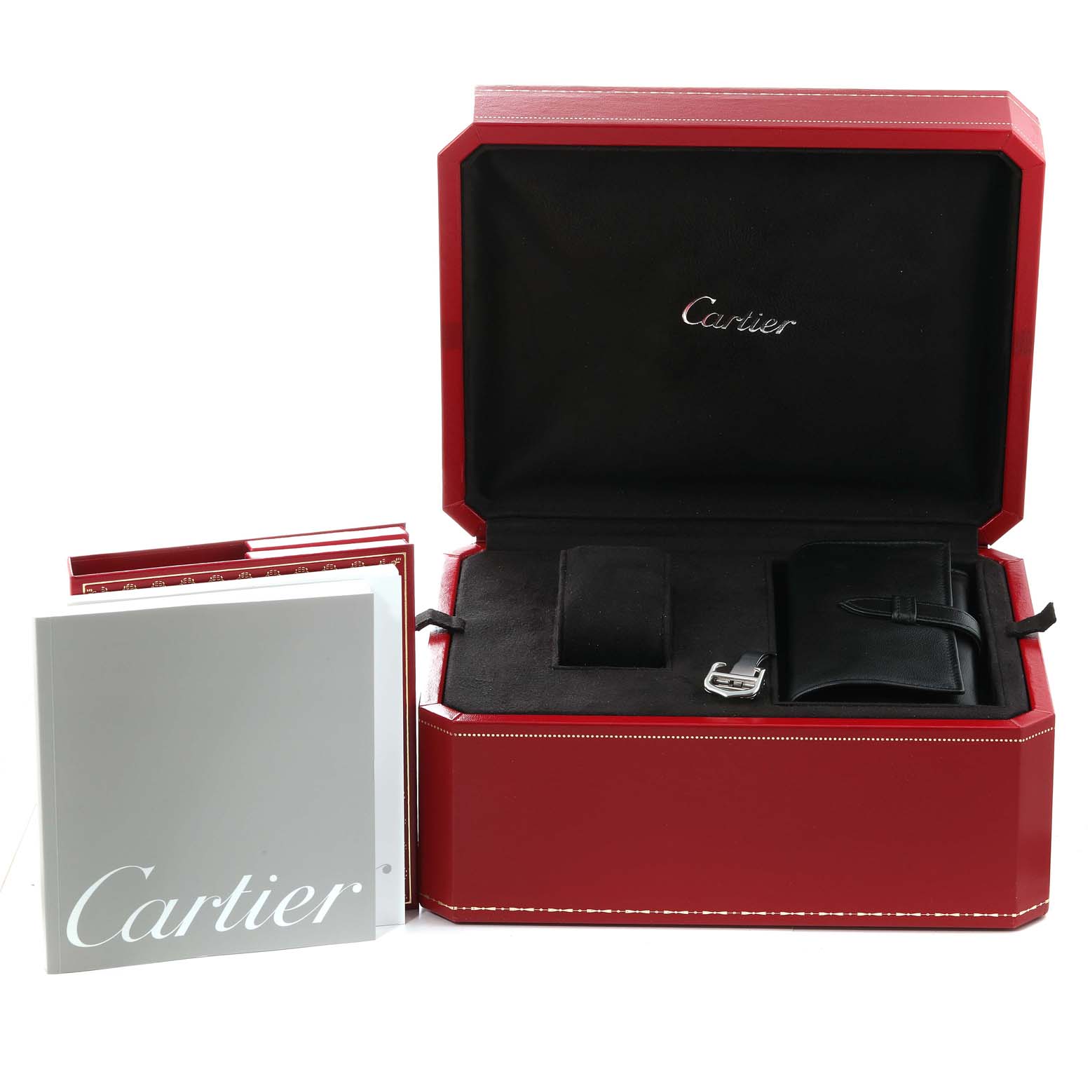 The image shows an open Cartier Roadster W62025V3 Men's Stainless Steel Silver Dial W62025V3 Men's Stainless Steel Silver Dial watch box with a booklet and accessories inside.