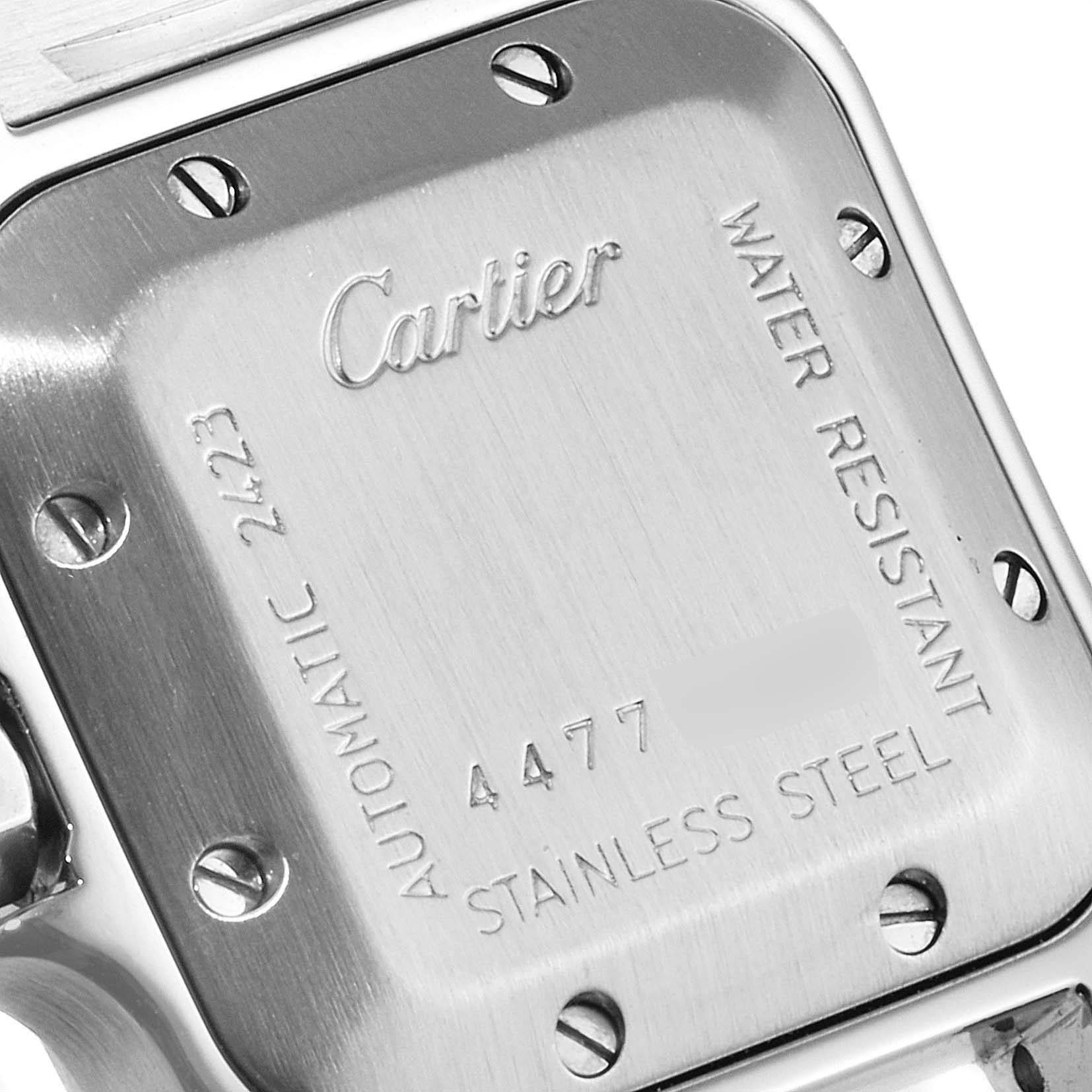 This is the stainless steel case back of the Santos model by Cartier, showing engraved details and screws.
