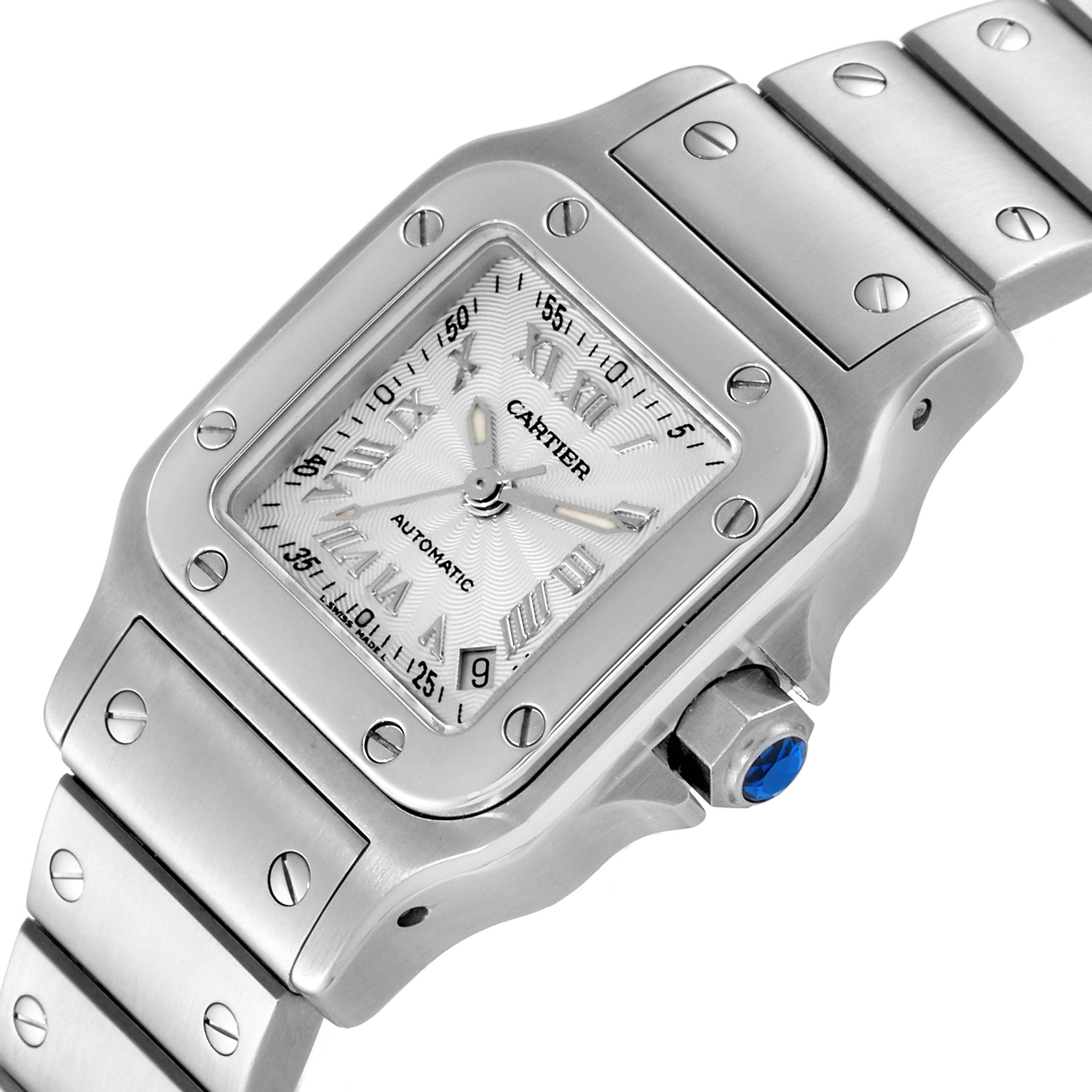 This image shows an angled view of the Cartier Santos W20044D6 Women's Stainless Steel Silver Dial W20044D6 Women's Stainless Steel Silver Dial watch face, bezel, crown, and part of the bracelet.