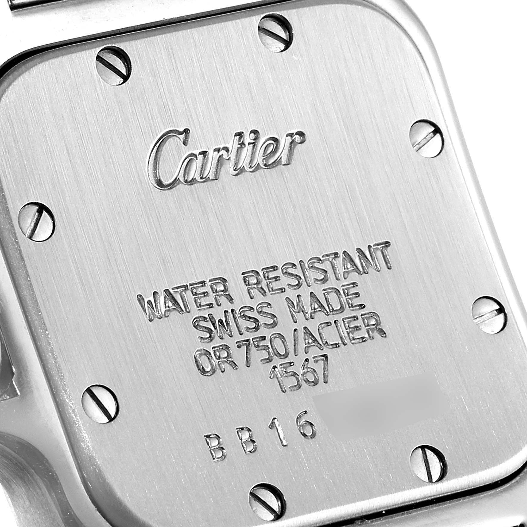 This image shows the engraved backplate of a Cartier Santos W20012C4 Women's Steel and Gold (two tone) Silver Dial W20012C4 Women's Steel and Gold (two tone) Silver Dial watch, displaying details like water resistance and Swiss craftsmanship.