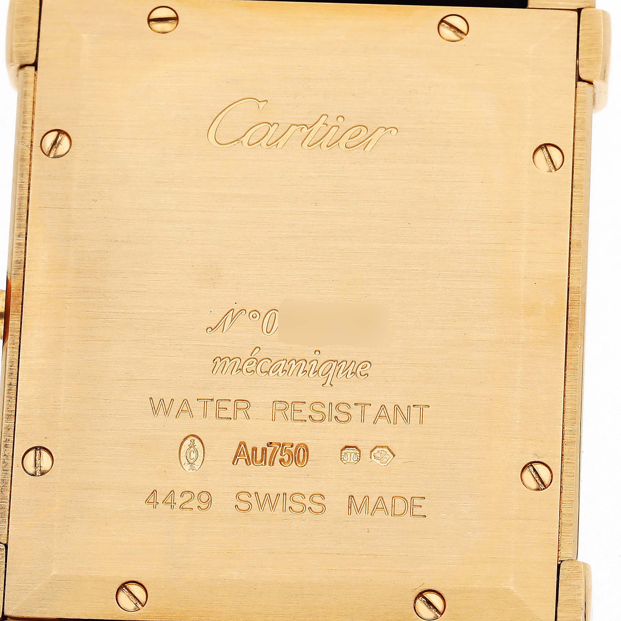 The image shows the back case of a Cartier Tank Louis WGTA0088 Men's Yellow Gold Champagne Dial watch, featuring engraved text and screws.