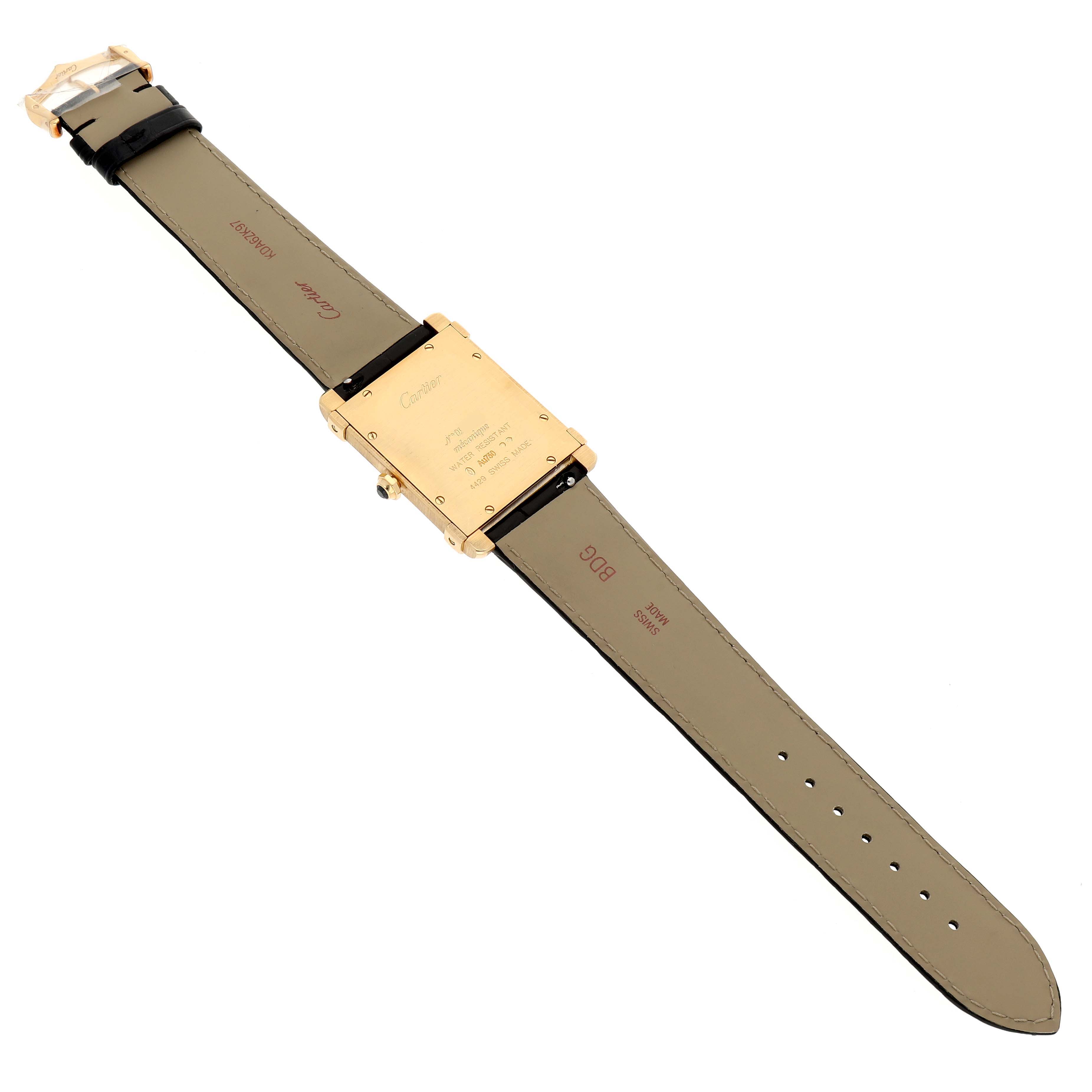 The Cartier Tank Louis WGTA0088 Men's Yellow Gold Champagne Dial watch is shown from the back, displaying the case back, lugs, and leather strap.