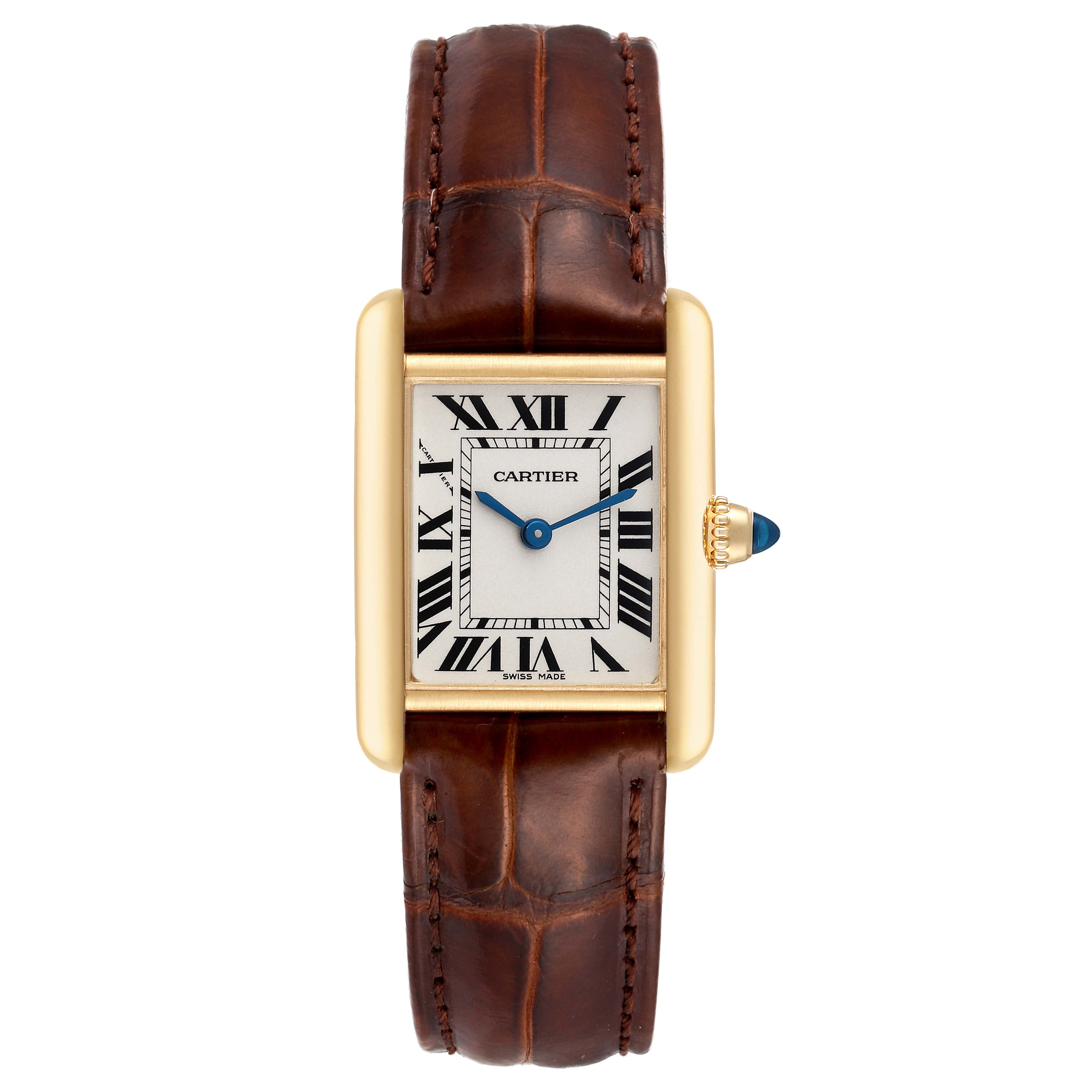 The image shows a front view of the Tank Louis watch by Cartier, highlighting its rectangular face, blue hands, and brown leather strap.