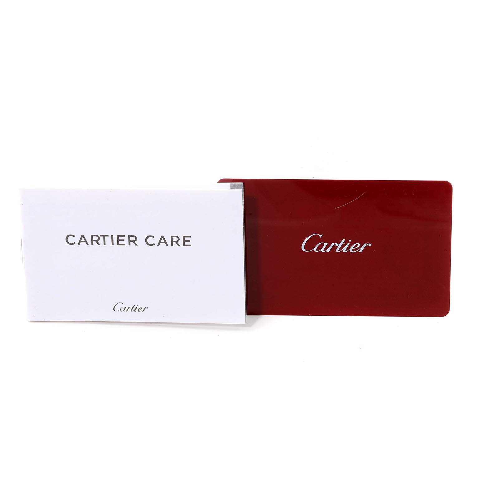 The image shows the Cartier Care booklet and a red Cartier card for the Tank Louis model by Cartier.