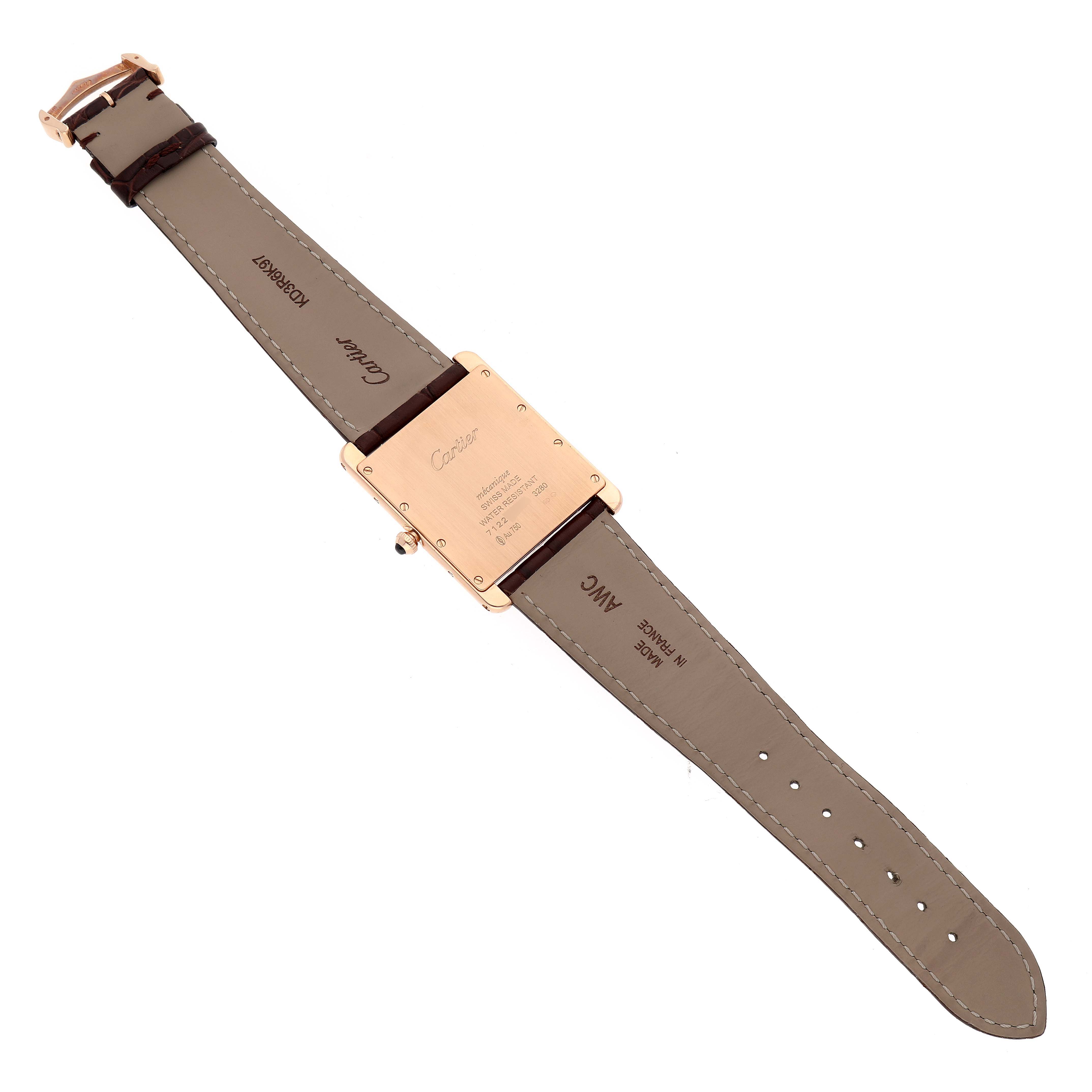 The image shows the back view of a Tank Louis model watch by Cartier, displaying the case back and leather straps.