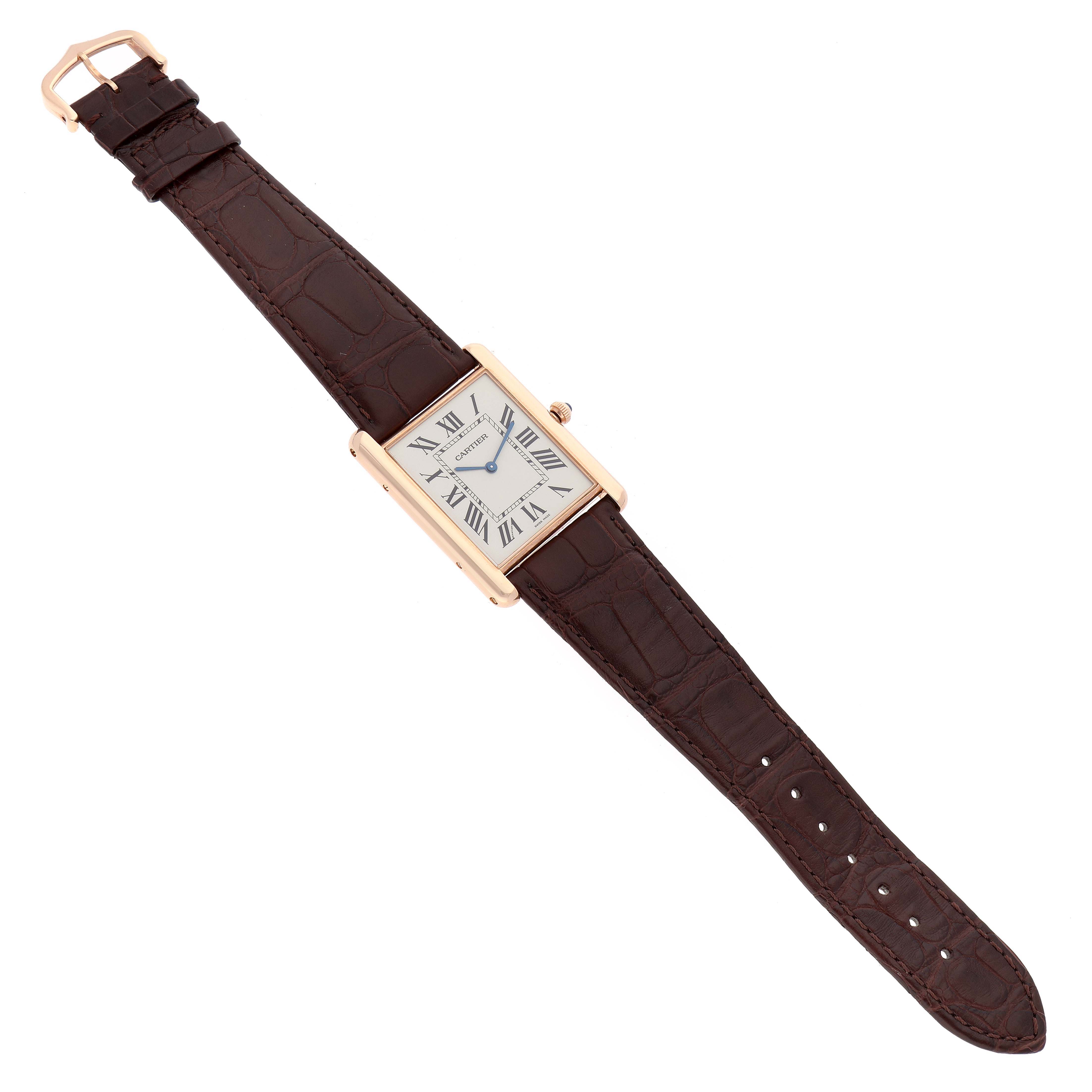 The watch is shown from a top-down angle, displaying the entire Cartier Tank Louis W1560017 Men's Rose Gold Silver Dial W1560017 Men's Rose Gold Silver Dial model with its strap and face visible.