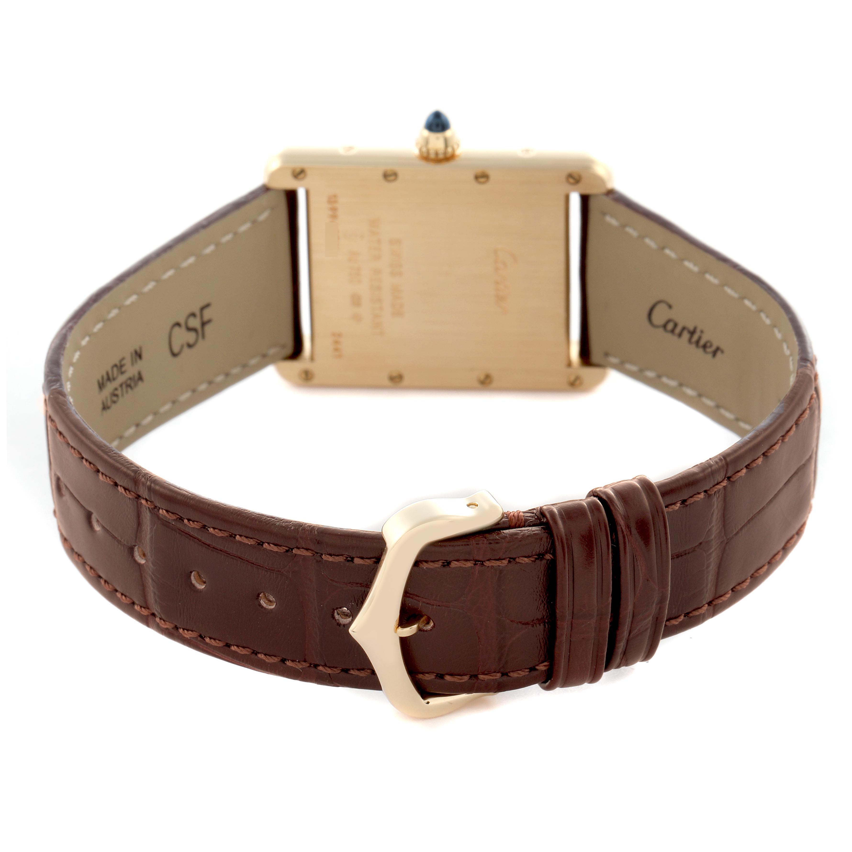 The image shows the back of a Cartier Tank Louis W1529756 Men
s Yellow Gold Silver Dial W1529756 Men
s Yellow Gold Silver Dial watch, highlighting the case back, crown, brown leather strap, and gold buckle.