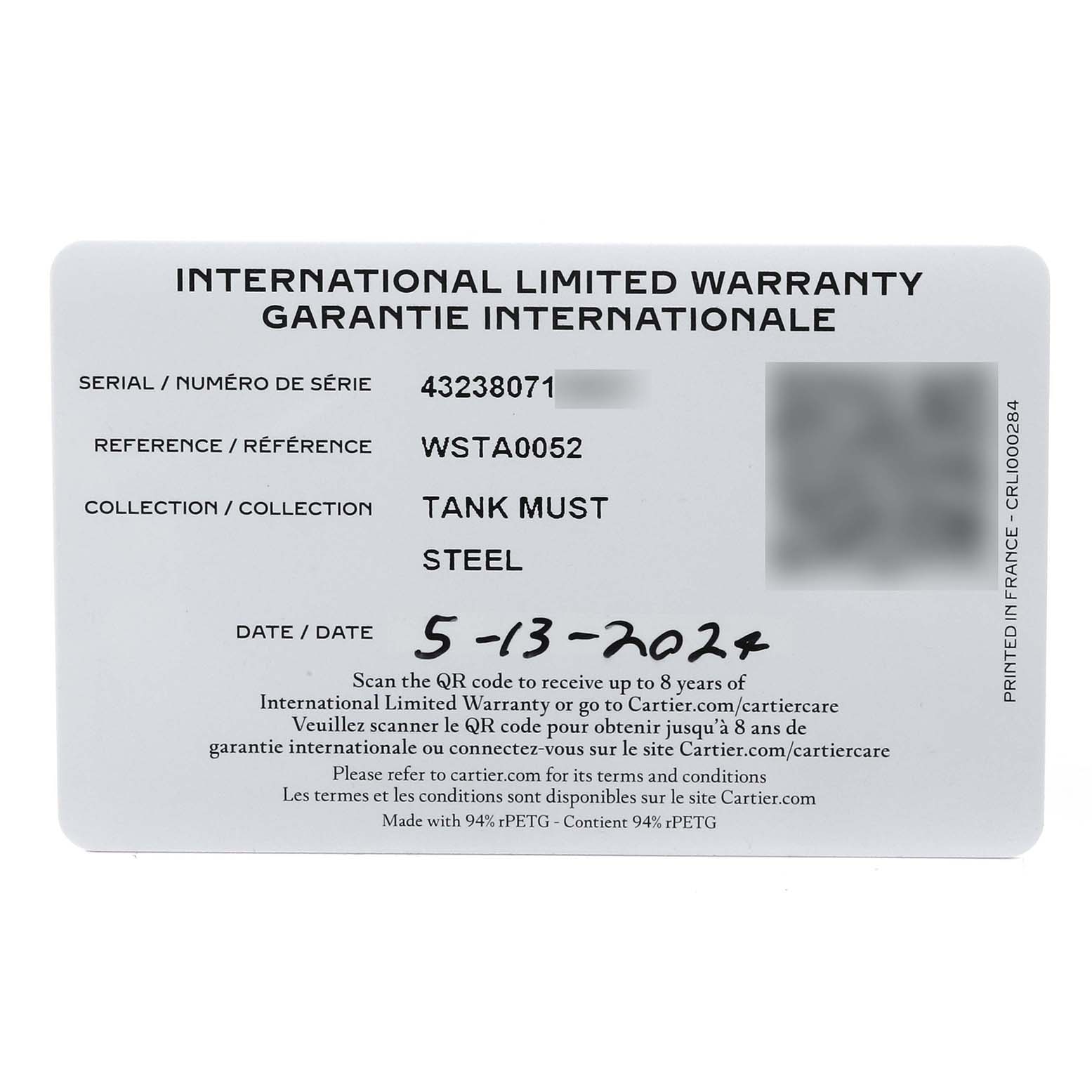 This image shows an International Limited Warranty card for a Cartier Tank Must WSTA0052 Women's Stainless Steel Silver Dial WSTA0052 Women's Stainless Steel Silver Dial watch, displaying details like serial number, reference, and date.