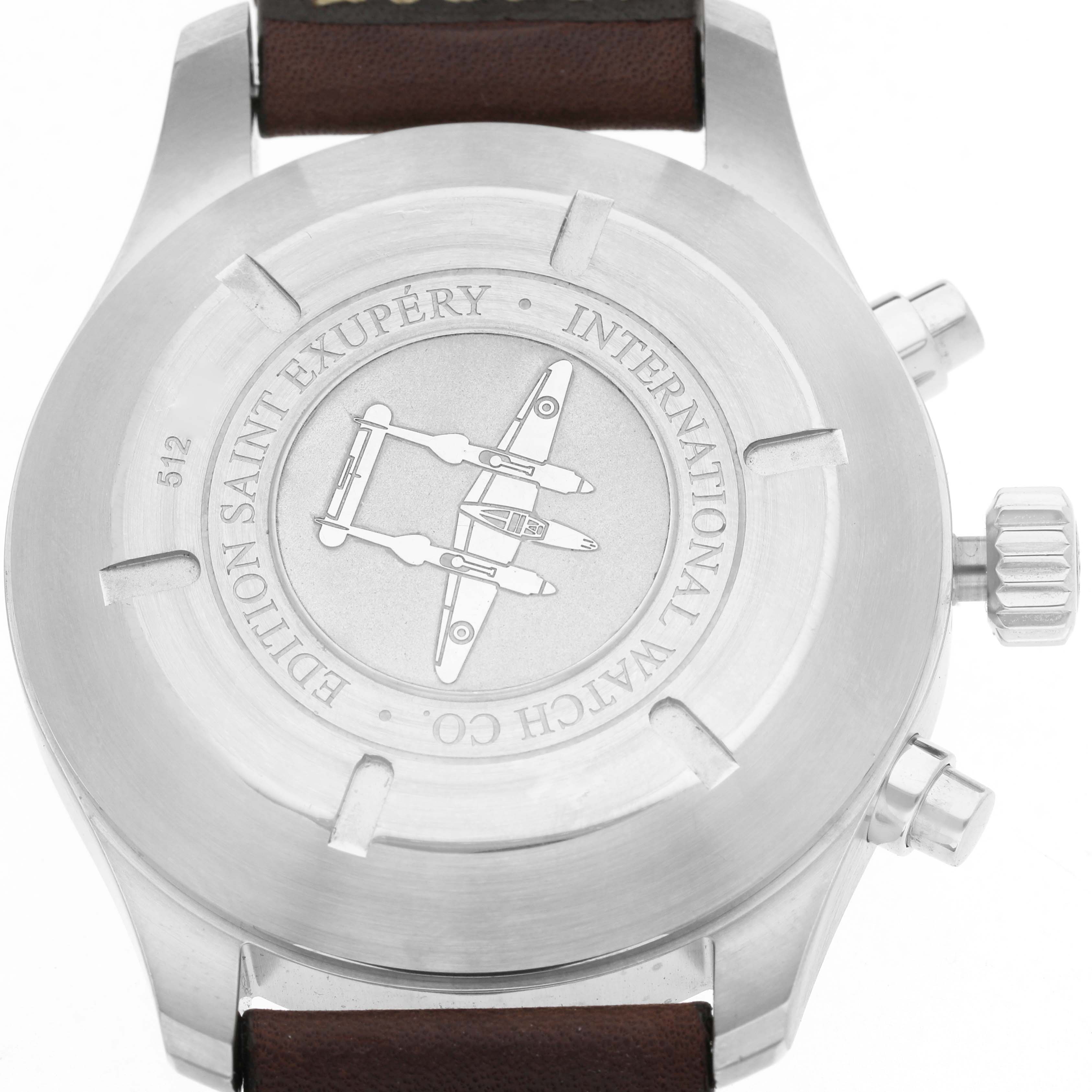 The image shows the back case and crown of the IWC Pilot IW387806 Men's Stainless Steel Brown Dial model, showcasing the engraved design and branding.