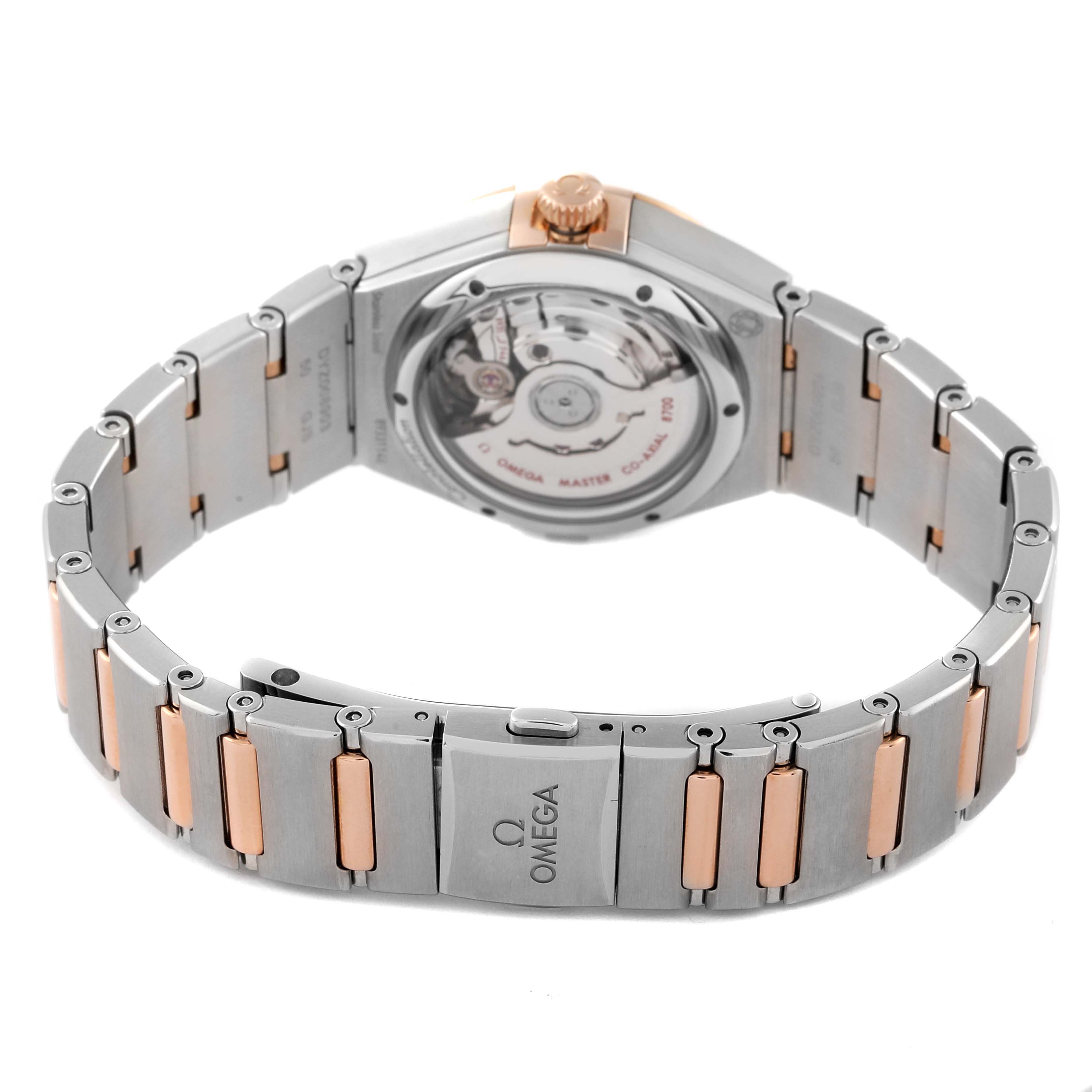 The image shows the back view of the Omega 131.25.29.20.55.001 Women's Steel and Gold (two tone) Mother of Pearl Dial 131.25.29.20.55.001 Women's Steel and Gold (two tone) Mother of Pearl Dial Constellation Steel Rose Gold Diamond Ladies Watch model 131.25.29.20.55.001, highlighting its bracelet and open case back.