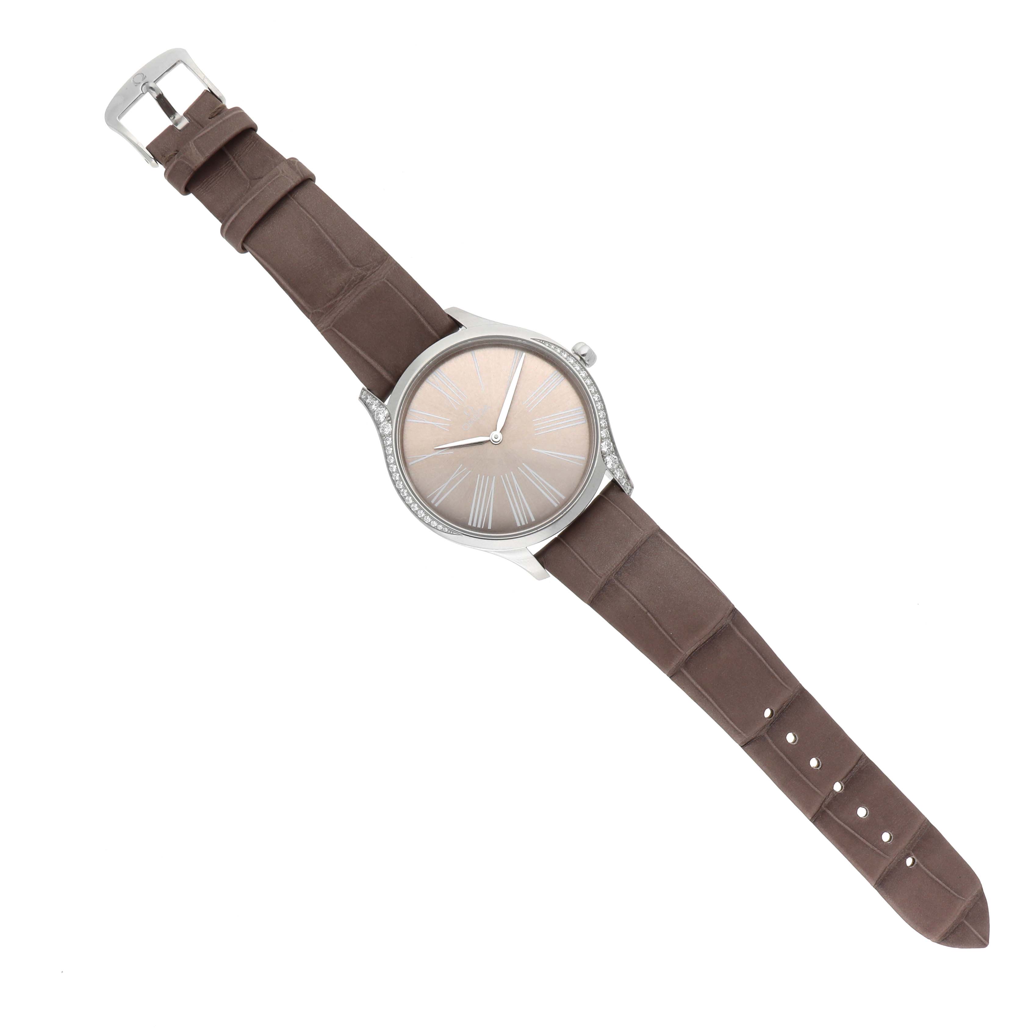 The Omega 428.18.39.60.13.001 Women's Stainless Steel Beige Dial DeVille Tresor Steel Diamond Ladies Watch is displayed from a top-down angle, showing the dial, strap, and side diamonds.