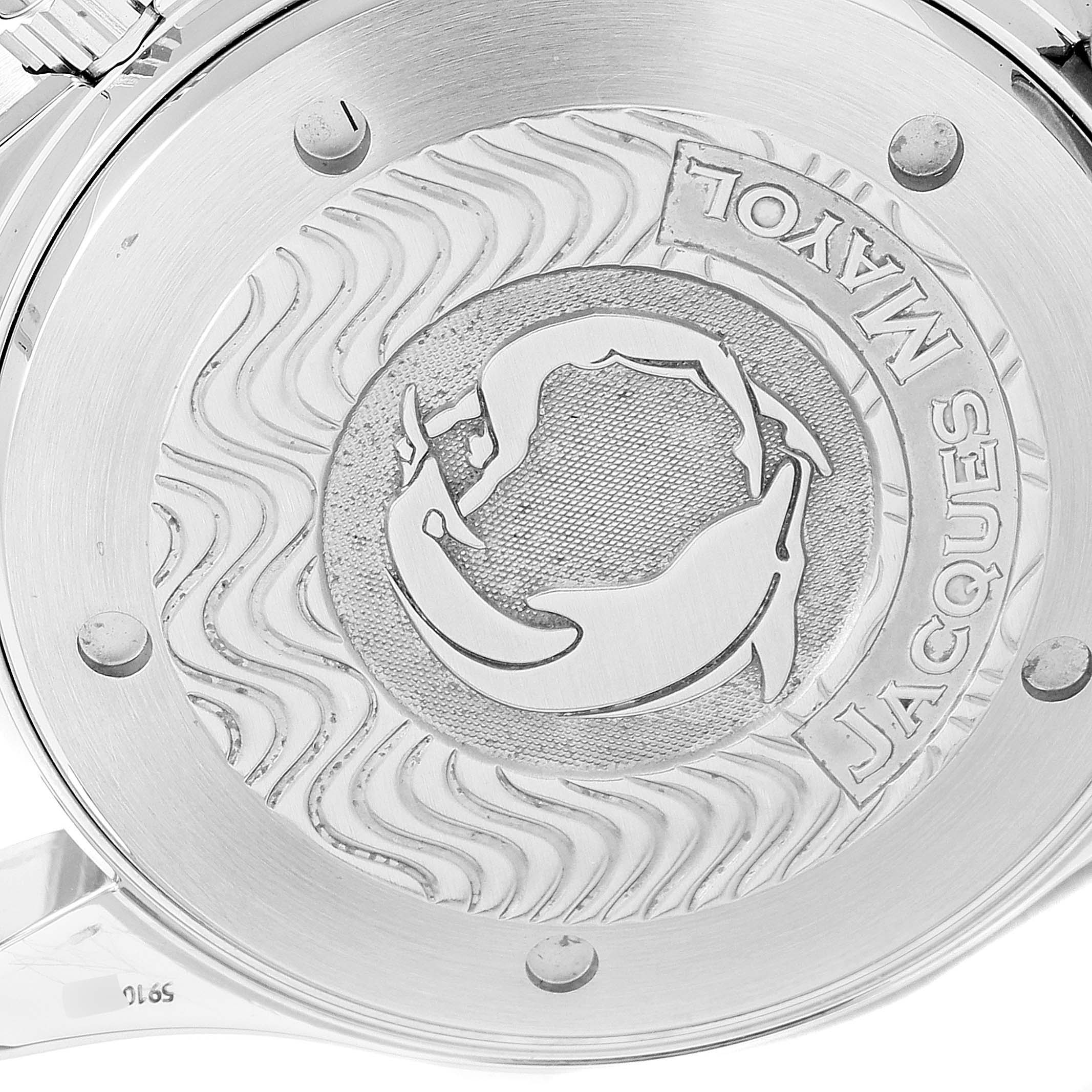 The image shows the engraved case back of an Omega Seamaster 2595.30.00 Men's Stainless Steel Silver Dial 2595.30.00 Men's Stainless Steel Silver Dial watch featuring wave patterns and an emblem.