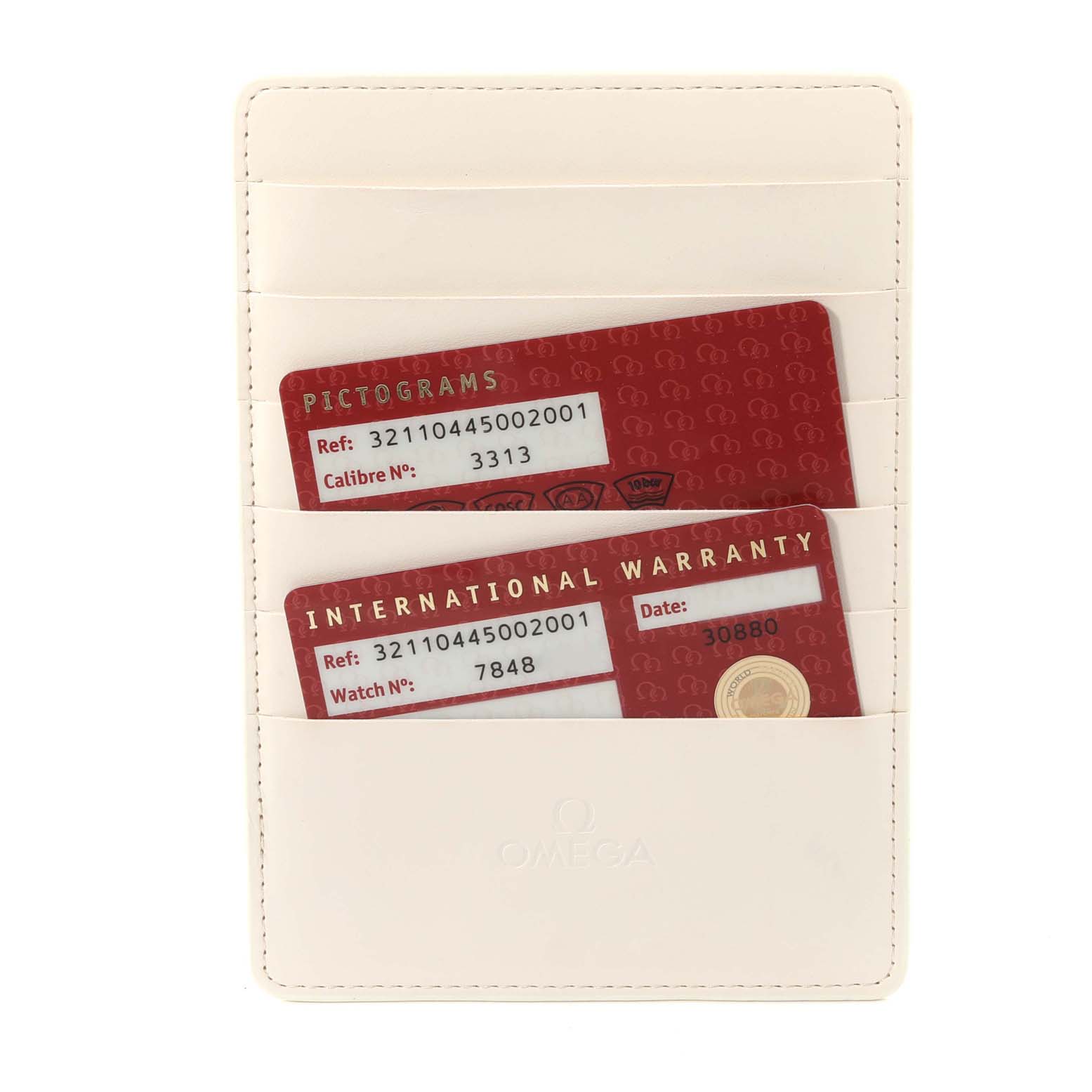 The image shows warranty cards and a pictogram card in a white holder for an Omega Speedmaster 321.10.44.50.02.001 Men
s Stainless Steel Silver Dial 321.10.44.50.02.001 Men
s Stainless Steel Silver Dial watch.