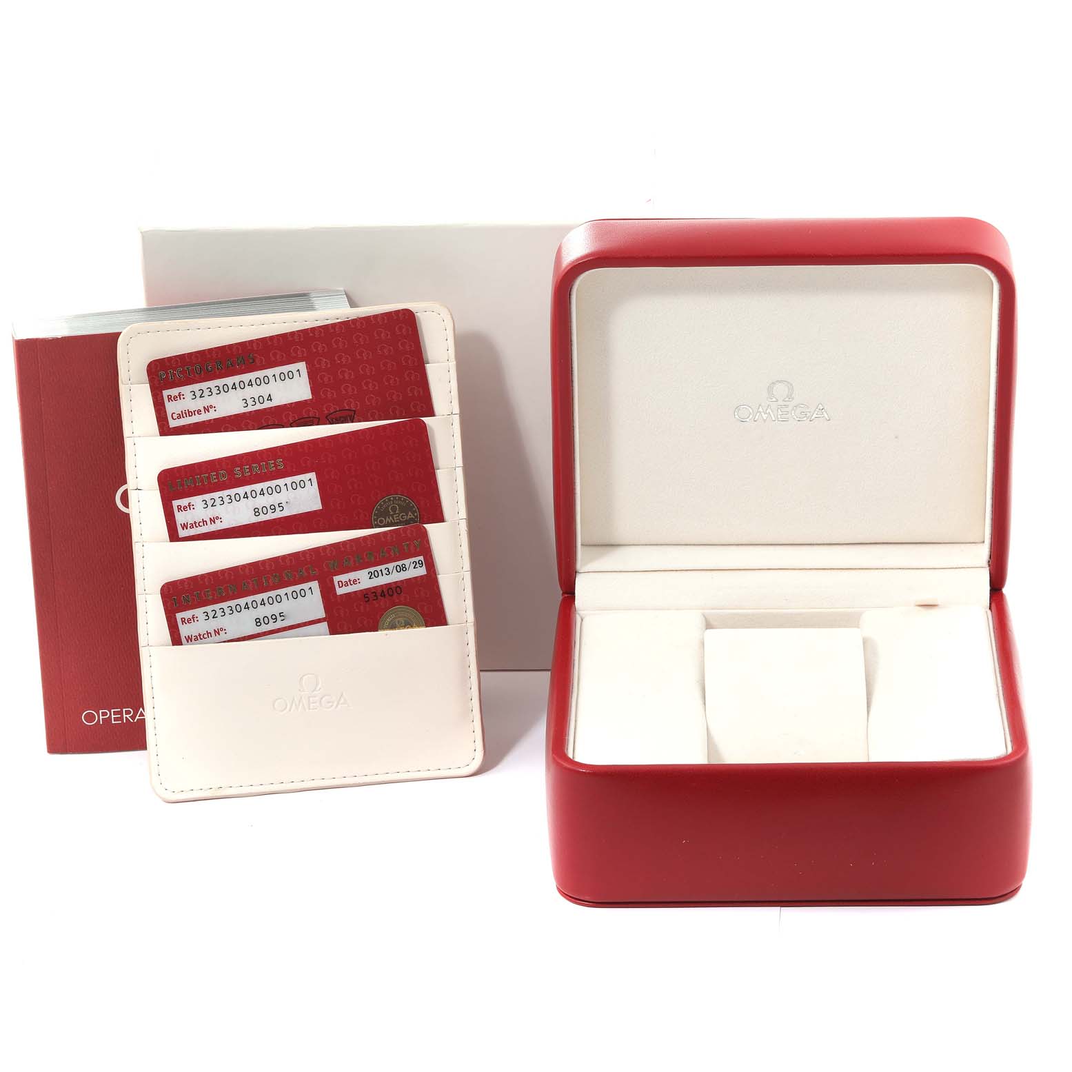 The image shows an Omega Speedmaster 323.30.40.40.01.001 Men
s Stainless Steel Black Dial 323.30.40.40.01.001 Men
s Stainless Steel Black Dial watch box, warranty cards, an instruction manual, and a card holder.