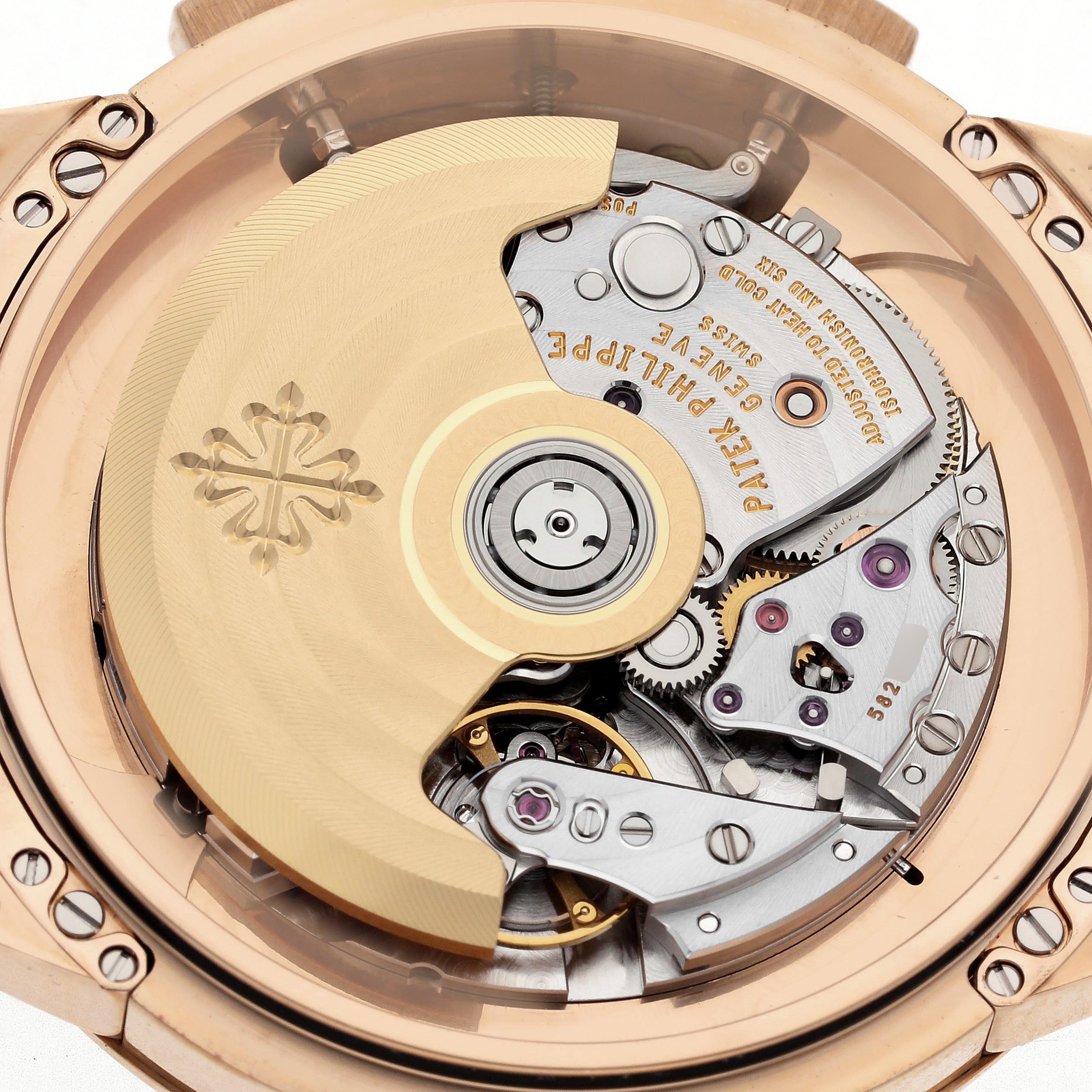 The image shows the back of a Patek Philippe Complications 5975R-001 Men
s Rose Gold Silver Dial 5975R-001 Men
s Rose Gold Silver Dial model, highlighting the movement and rotor.