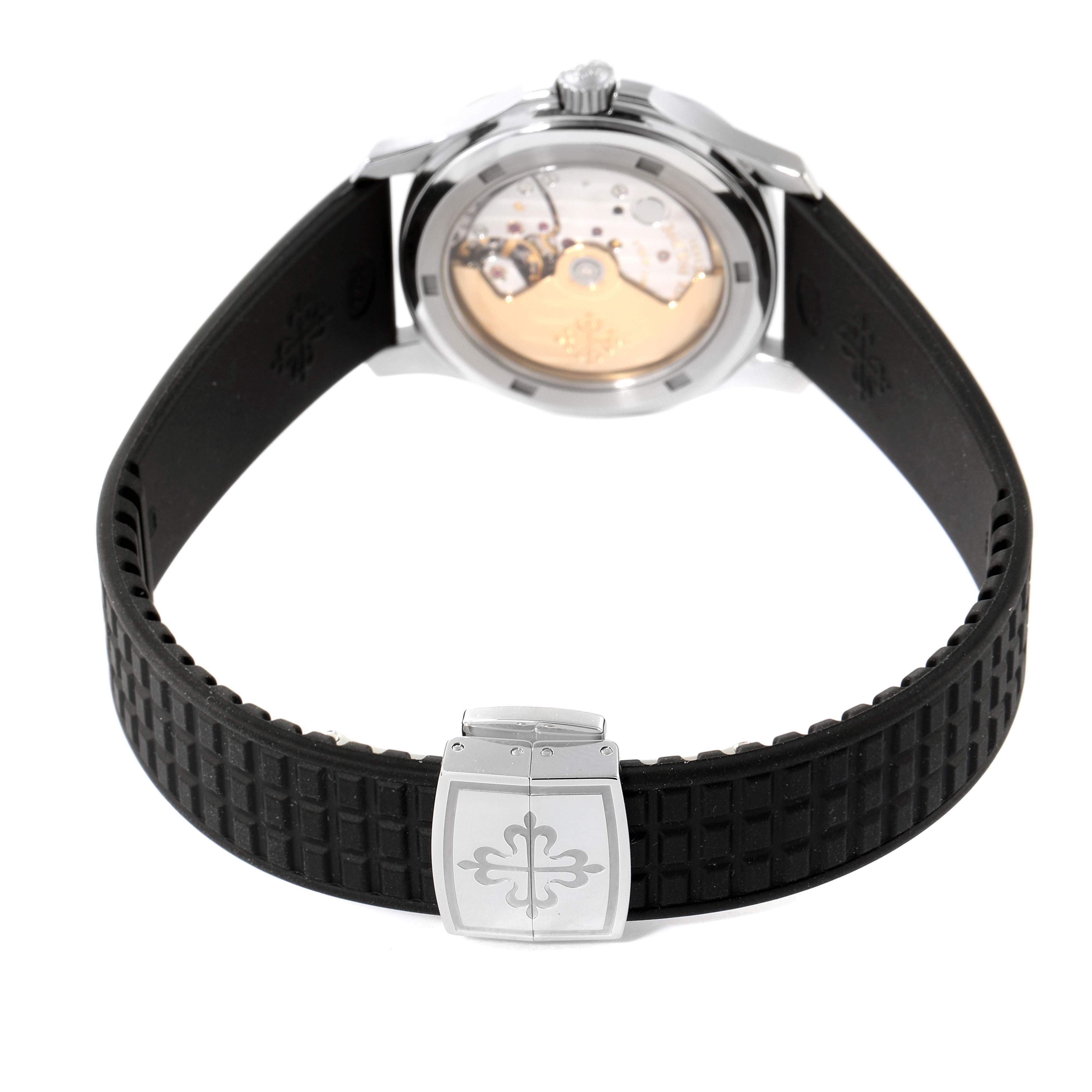 The image shows the back view of a Patek Philippe Aquanaut 5066A-001 Men
s Stainless Steel Black Dial 5066A-001 Men
s Stainless Steel Black Dial watch, highlighting its open case back and black rubber strap with clasp.