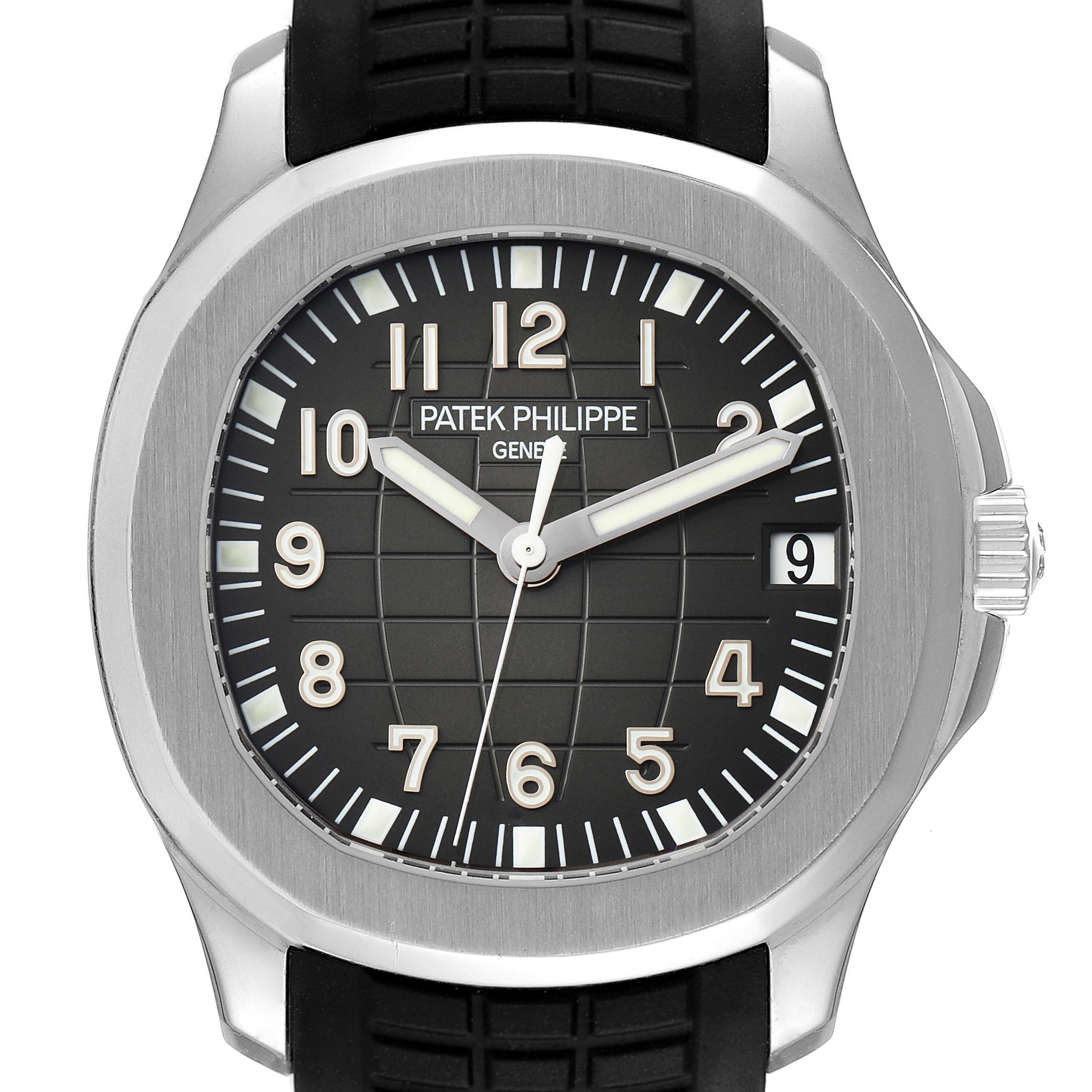 The image shows a frontal view of a Patek Philippe Aquanaut 5165A-001 Men's Stainless Steel Black Dial 5165A-001 Men's Stainless Steel Black Dial watch, including its face, case, hands, and part of the strap.