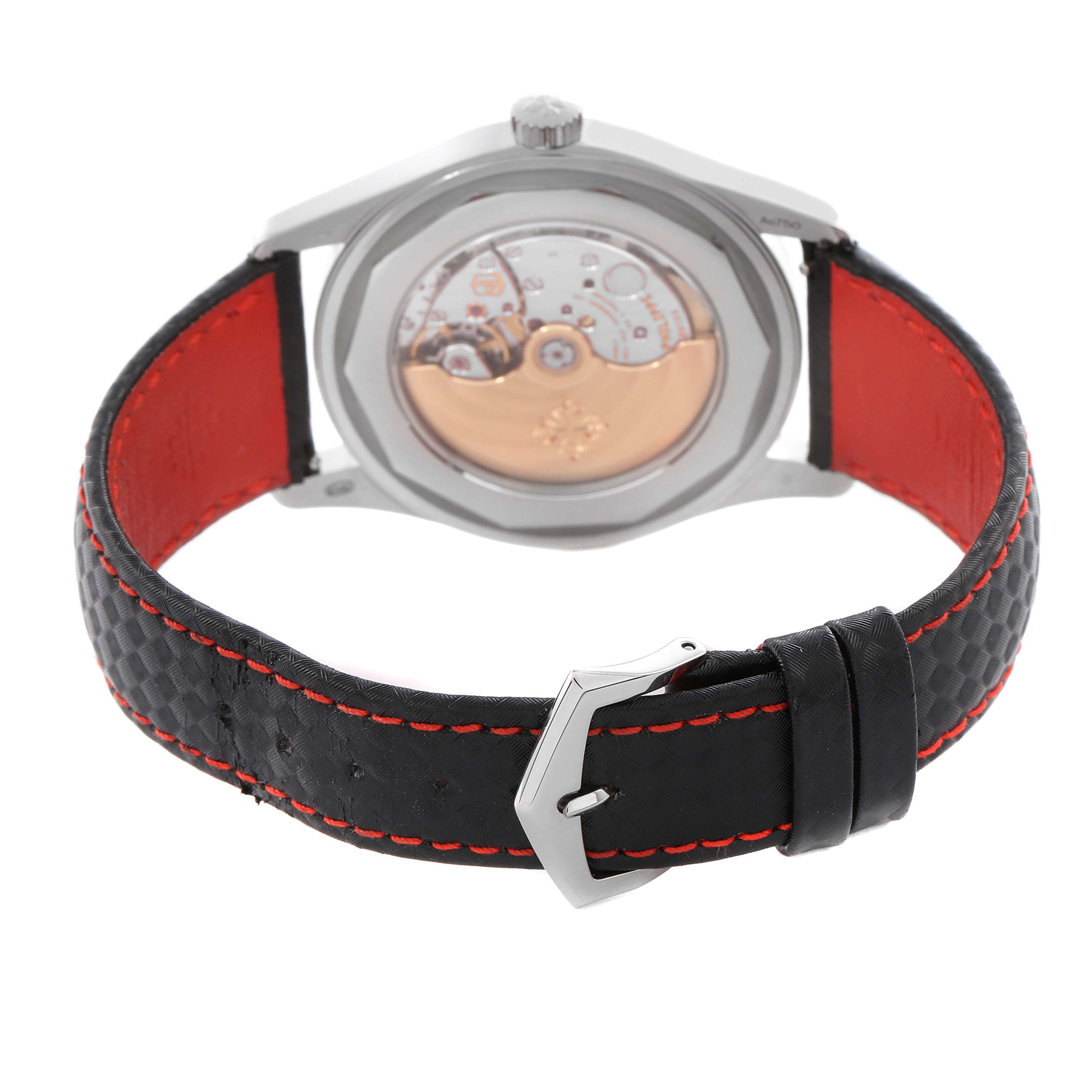 The image shows the back of a Patek Philippe Calatrava 6007G Men
s White Gold Black Dial 6007G Men
s White Gold Black Dial watch, highlighting the movement and black strap with red stitching.