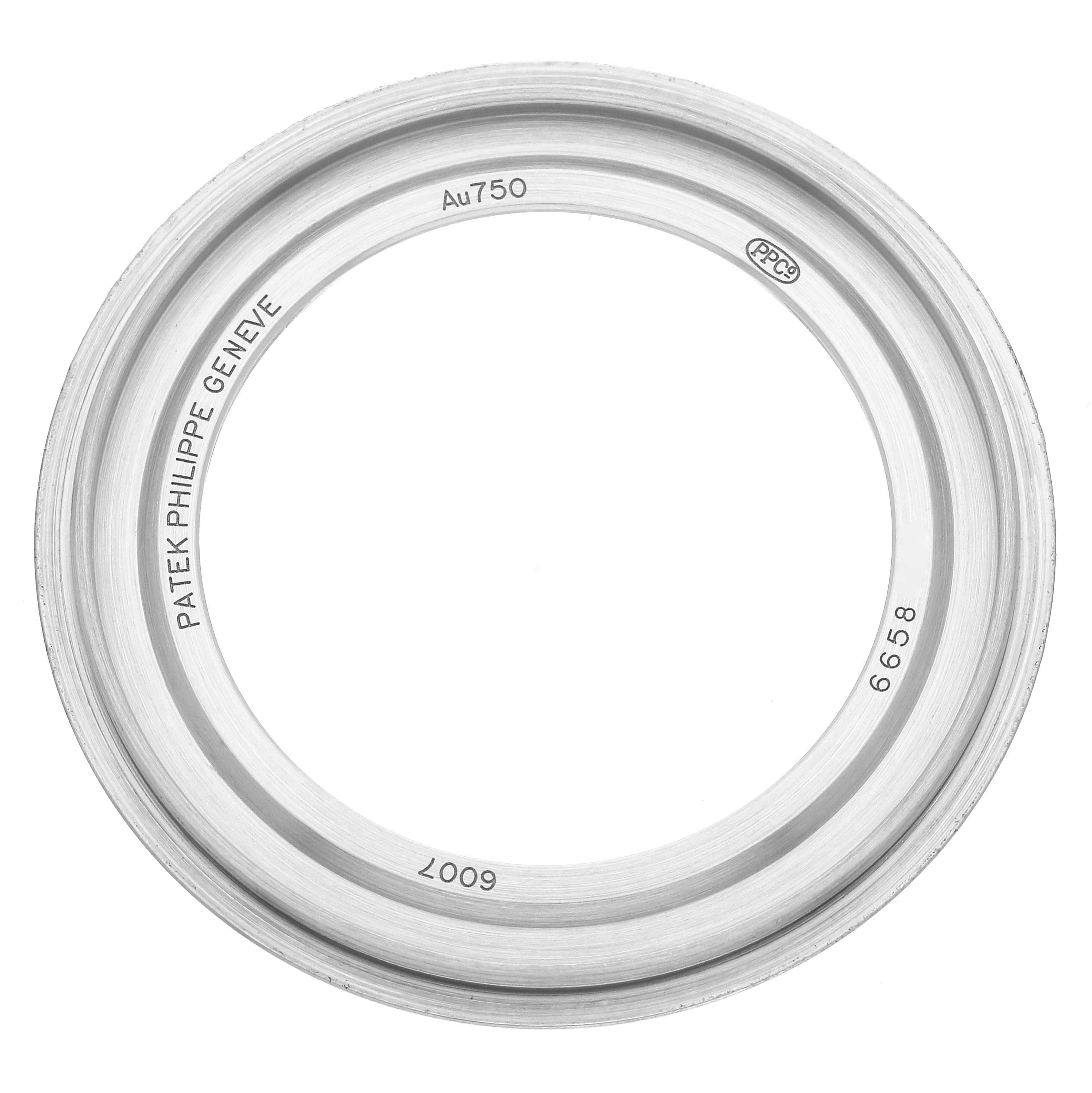 The image shows the back case frame of a Patek Philippe Calatrava 6007G Men
s White Gold Black Dial 6007G Men
s White Gold Black Dial watch from a top-down angle.