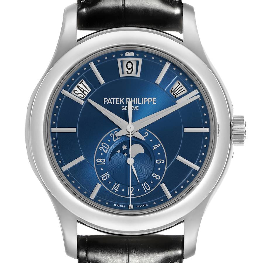 The Patek Philippe Complications watch is shown from a front angle, highlighting the blue dial, moon phase, and date displays.