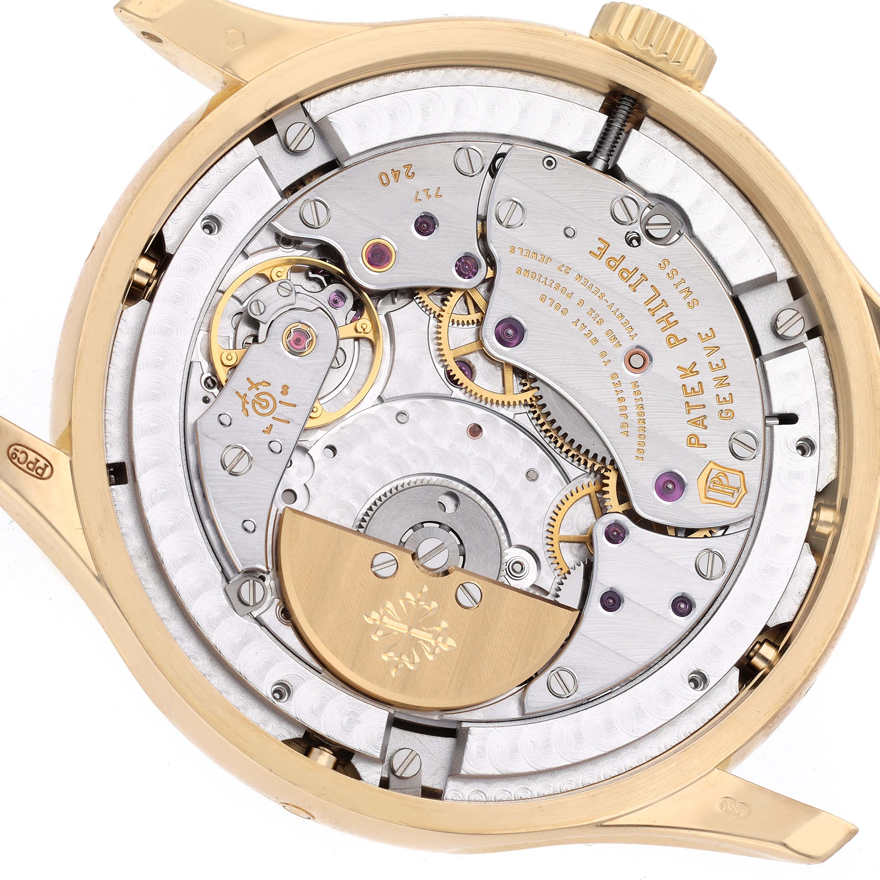 The image shows the back view of a Patek Philippe Complications 5327J Men
s Yellow Gold Beige Dial 5327J Men
s Yellow Gold Beige Dial model, highlighting its intricate movement and components.