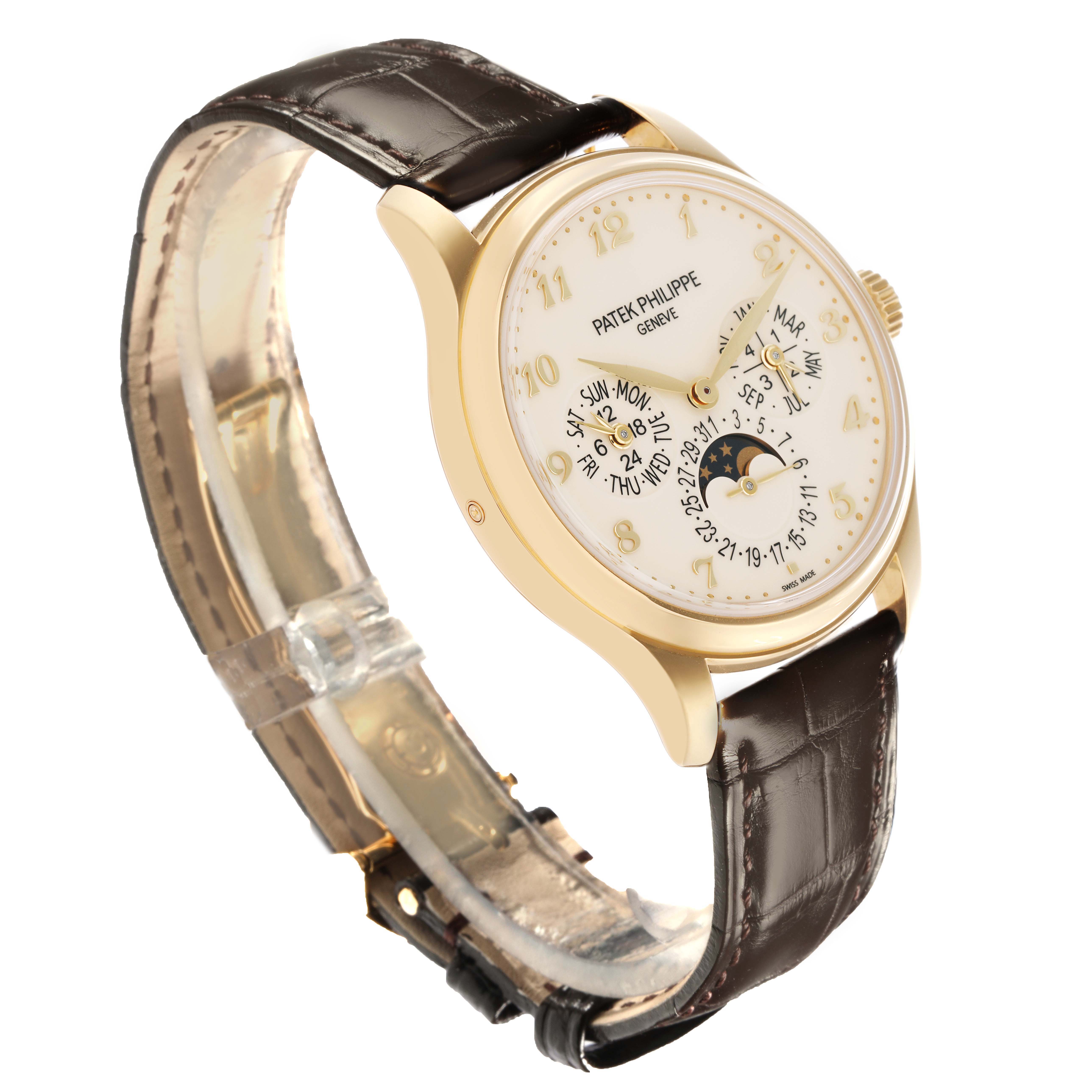 The Patek Philippe Complications 5327J Men
s Yellow Gold Beige Dial 5327J Men
s Yellow Gold Beige Dial watch is shown at an oblique angle, displaying the face, case, and brown leather strap.