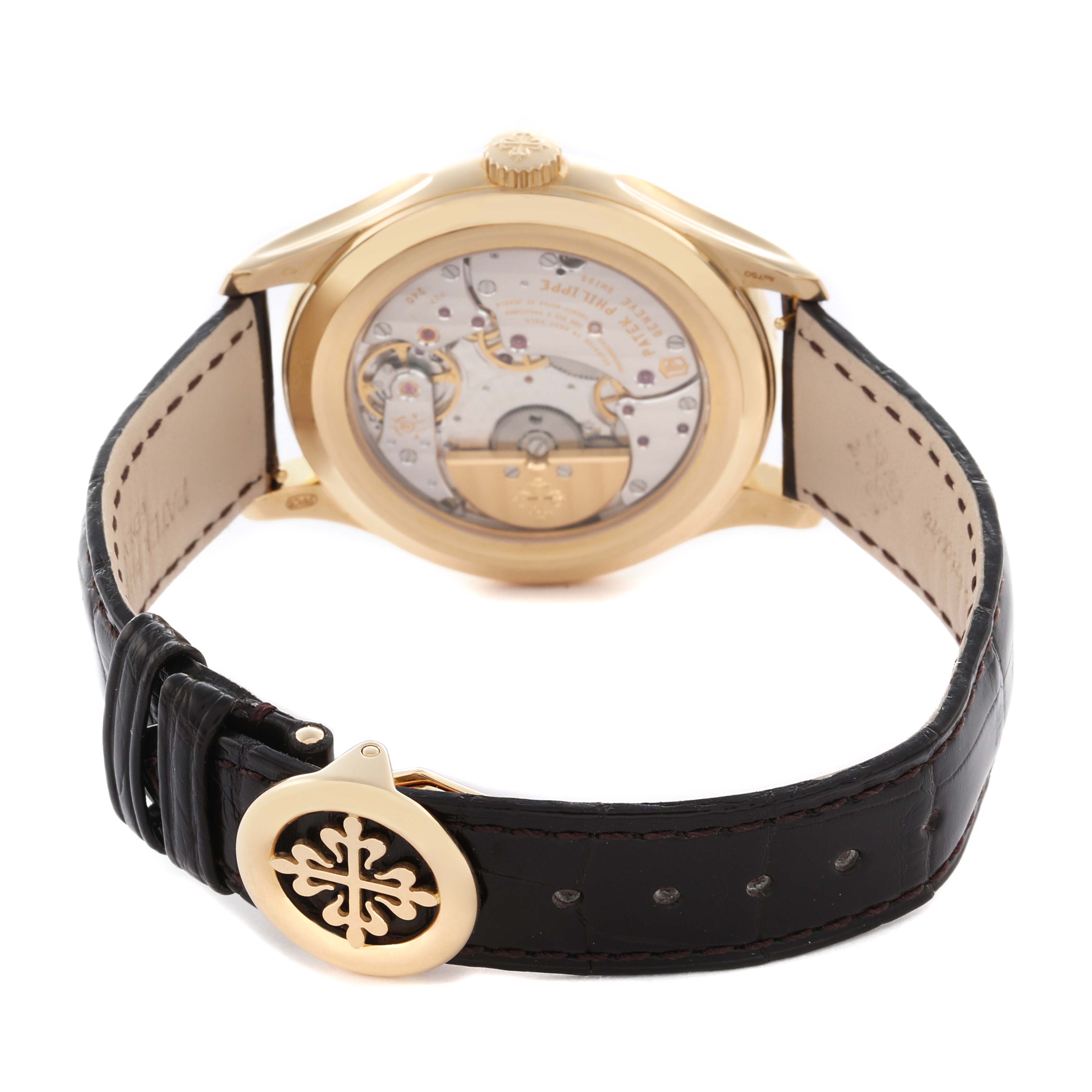 The image shows the back view of a Patek Philippe Complications 5327J Men
s Yellow Gold Beige Dial 5327J Men
s Yellow Gold Beige Dial watch, highlighting the movement and clasp.