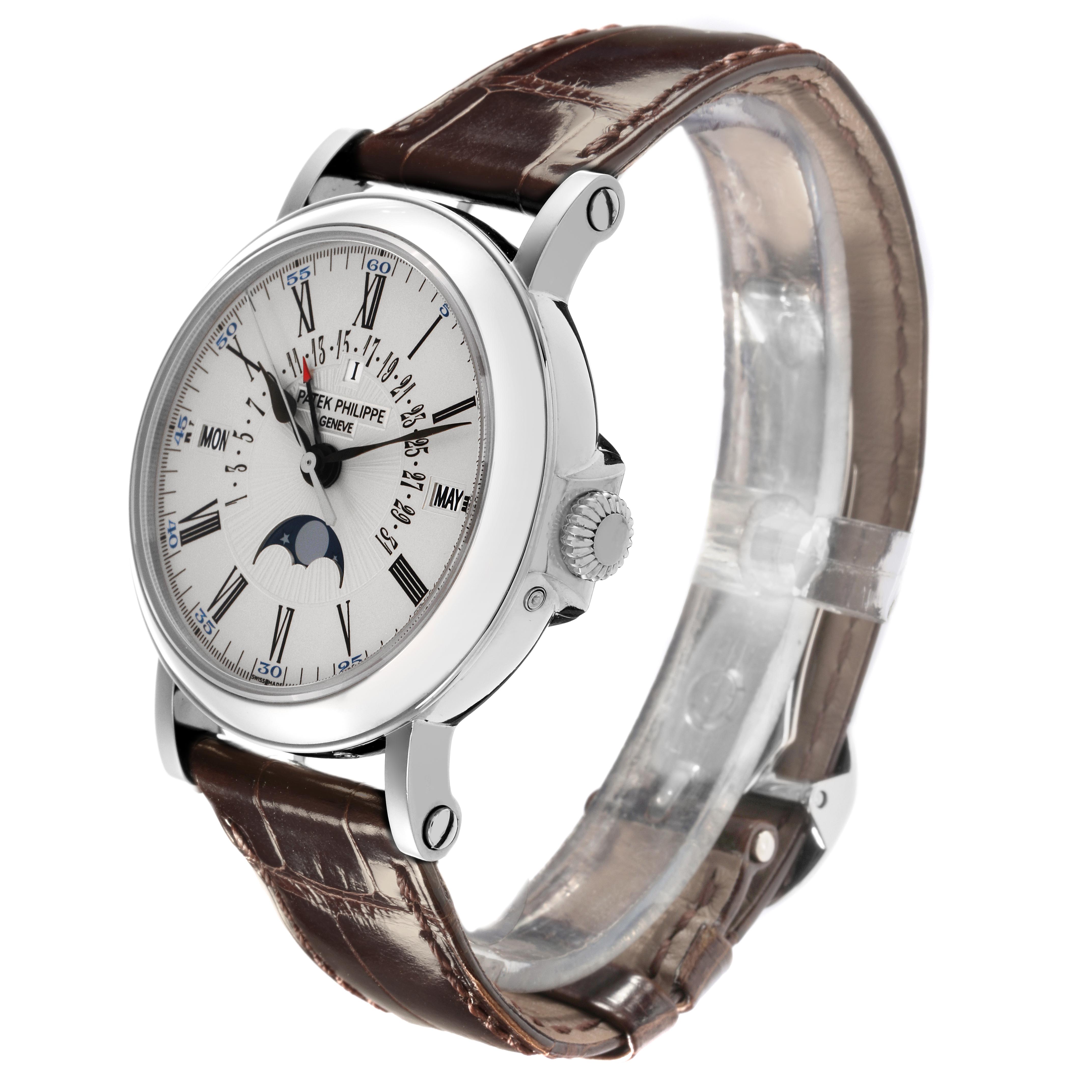 The Patek Philippe Complications 5159G-001 Men's White Gold Silver Dial 5159G-001 Men's White Gold Silver Dial watch is shown at a three-quarter angle, highlighting the dial, case, and brown leather strap.