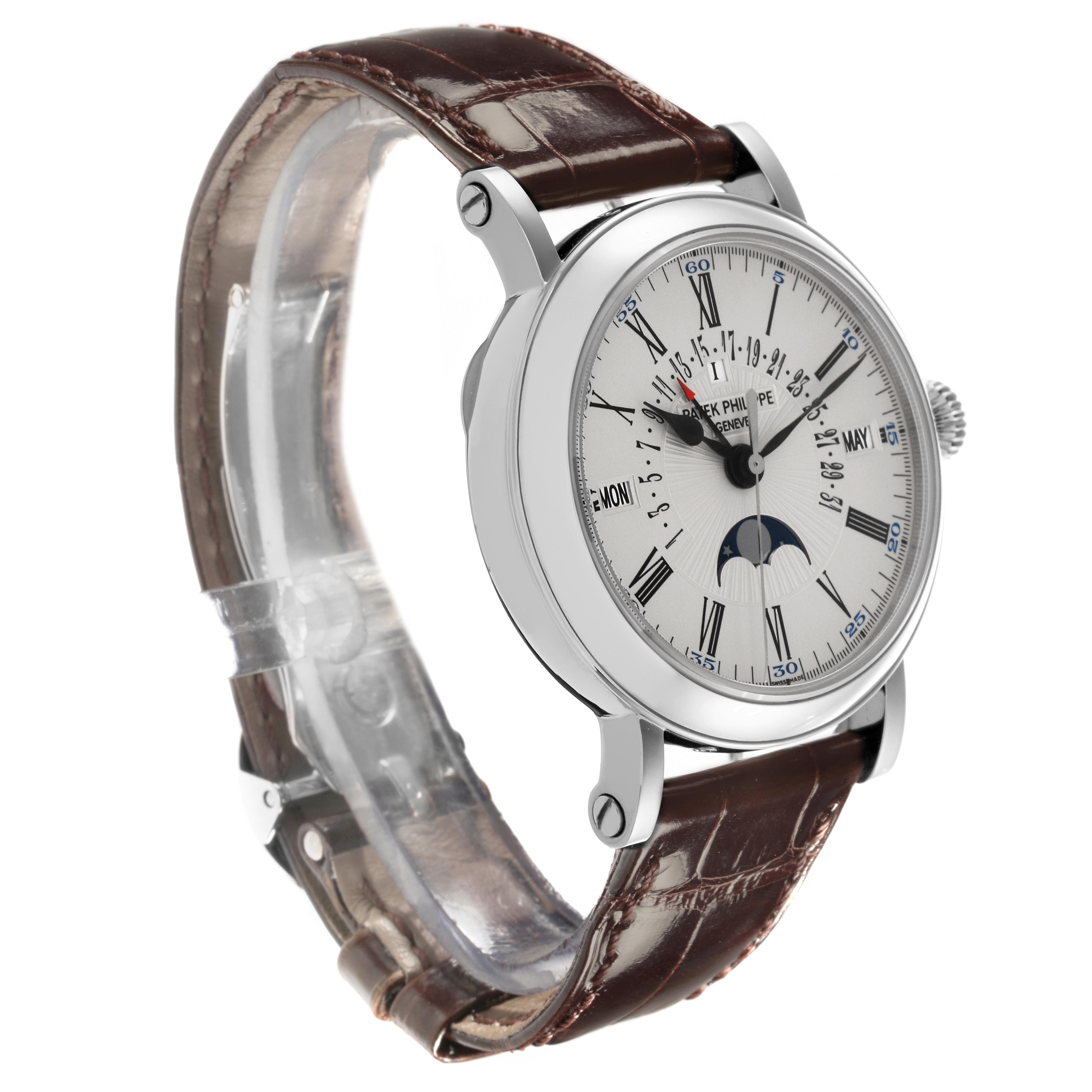 The Patek Philippe Complications 5159G-001 Men's White Gold Silver Dial 5159G-001 Men's White Gold Silver Dial watch is shown at a slight angle displaying the face, case, and brown leather strap.