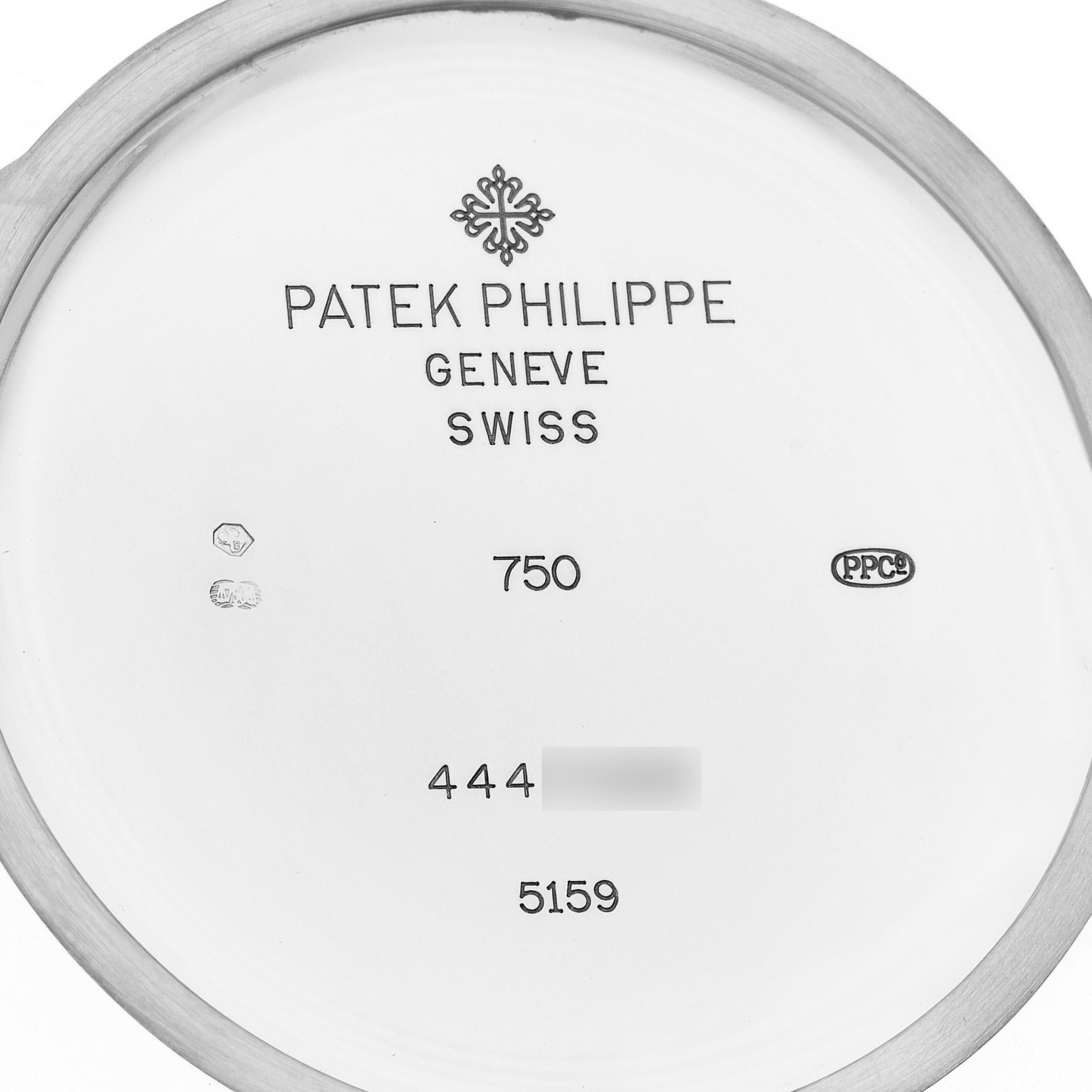 The image shows the inner side of a Patek Philippe Complications 5159G-001 Men's White Gold Silver Dial 5159G-001 Men's White Gold Silver Dial model watch case back, featuring inscriptions and hallmarks.