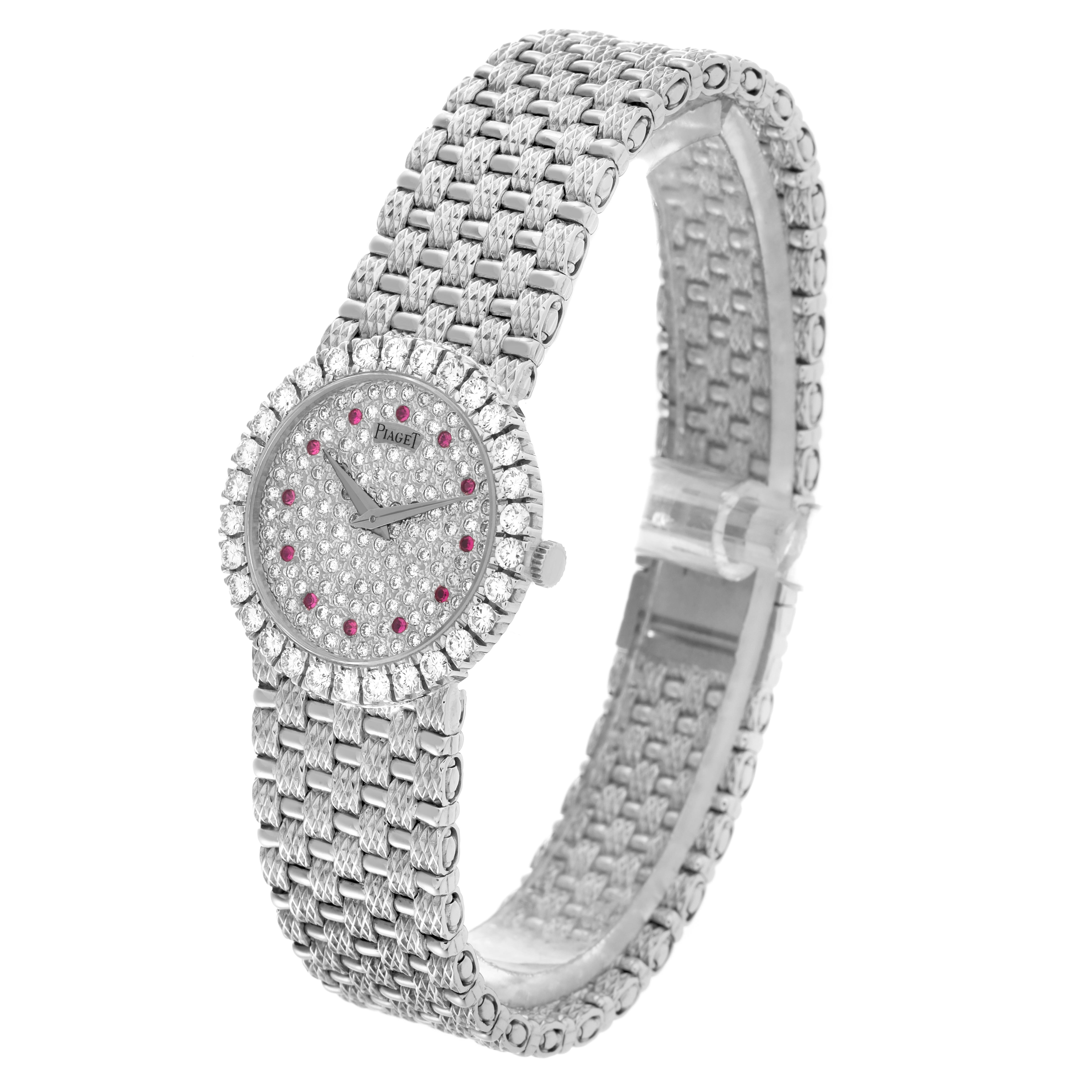 The Piaget 9190D23 Women
s White Gold Silver Dial 9190D23 Women
s White Gold Silver Dial Tradition 9190D23 watch is shown from a three-quarter angle, highlighting its diamond-set face, ruby markers, and bracelet.