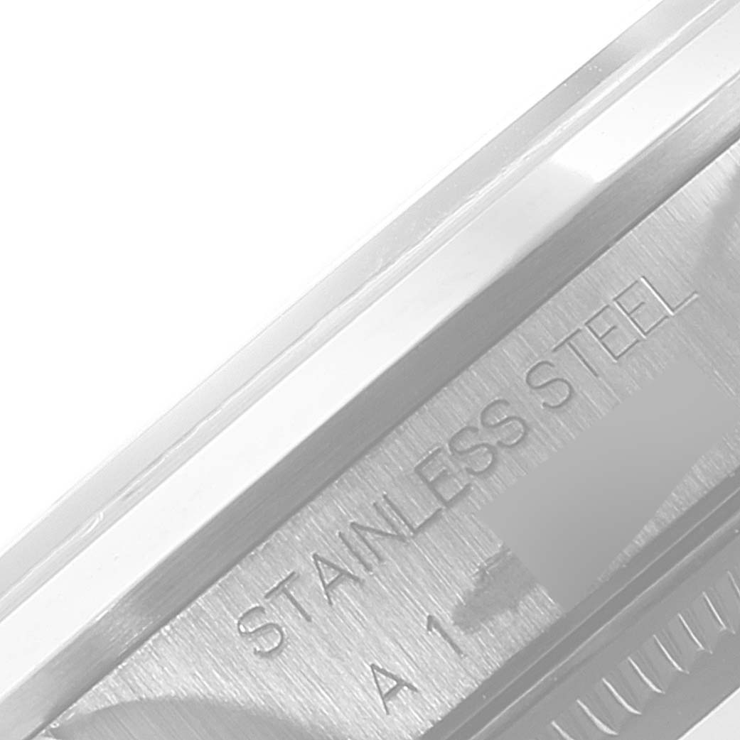 This close-up image shows part of the caseback with "STAINLESS STEEL" engraving of a Rolex Air-King 14000 Men's Stainless Steel Blue Dial 14000 Men's Stainless Steel Blue Dial watch.