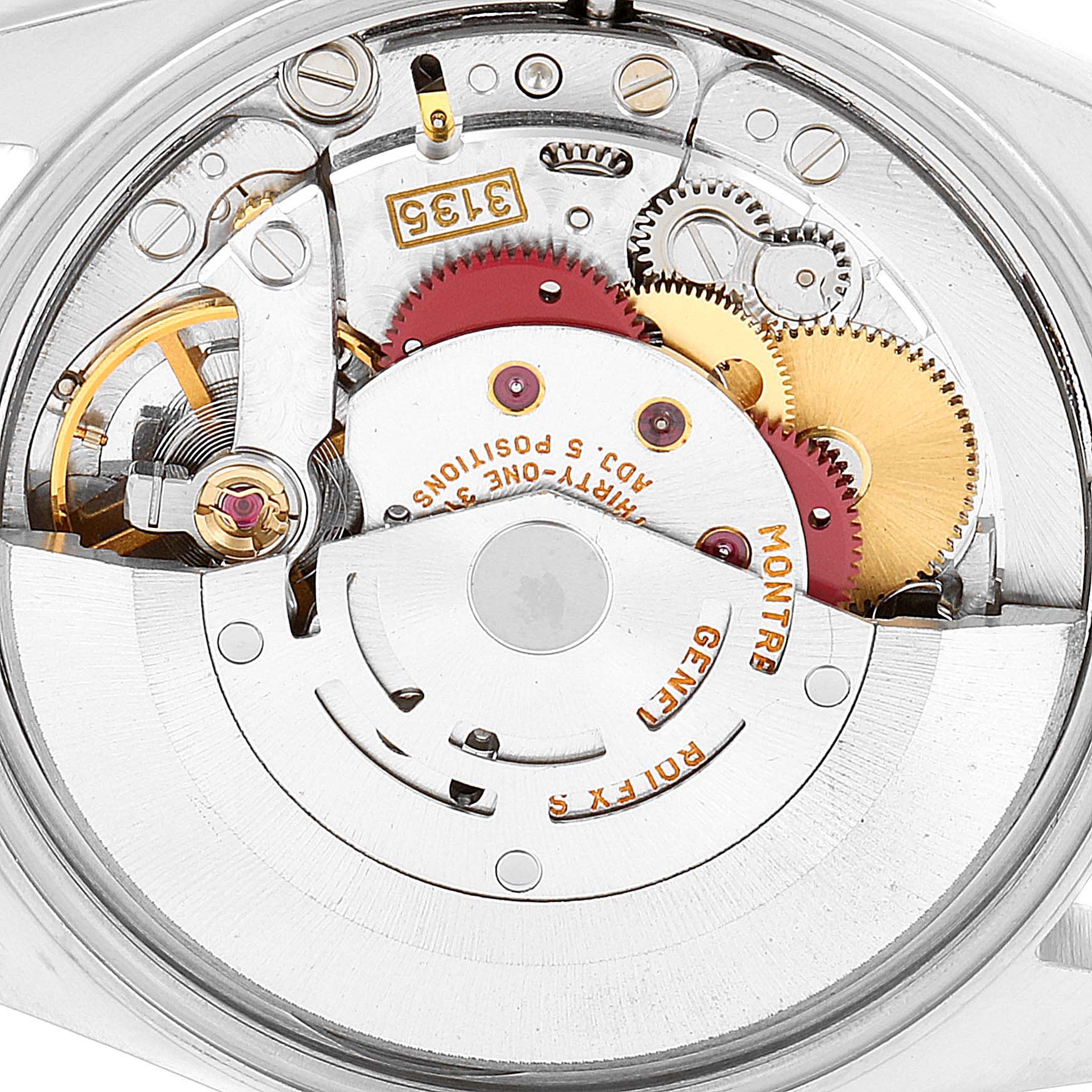 This is a close-up view of the movement mechanism of a Rolex Date 15210 Men's Stainless Steel Blue Dial 15210 Men's Stainless Steel Blue Dial model watch, showcasing gears and intricate parts.