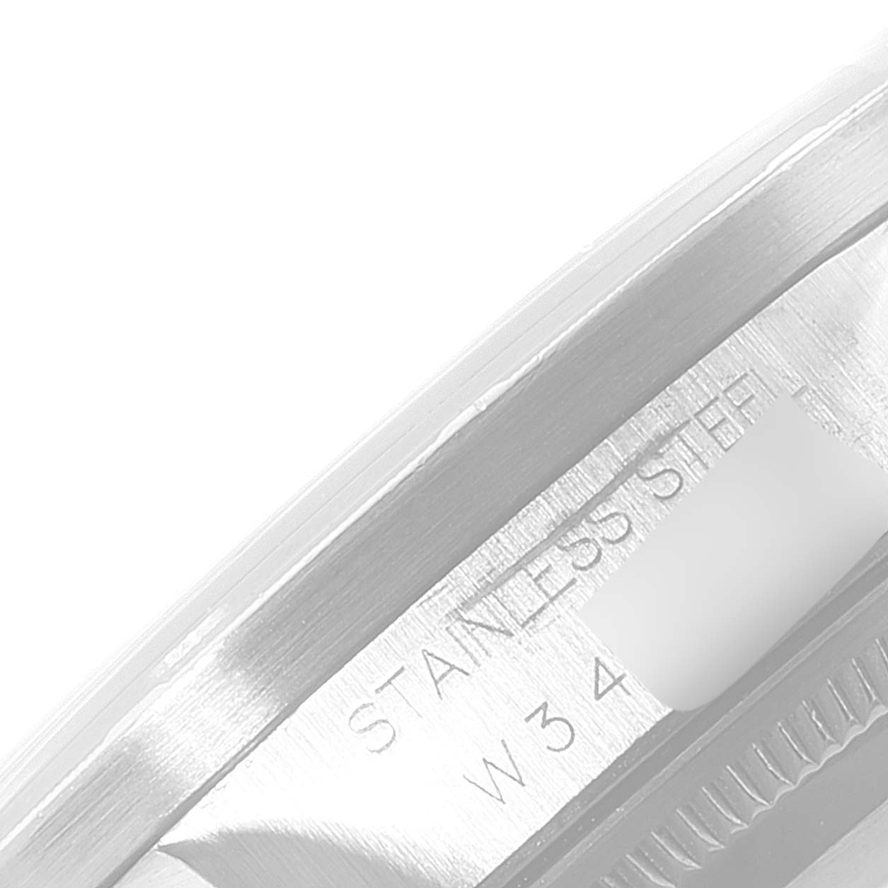 This image shows a close-up angle of the stainless steel part and some engravings on the Rolex Date 15210 Men's Stainless Steel Blue Dial 15210 Men's Stainless Steel Blue Dial model watch.
