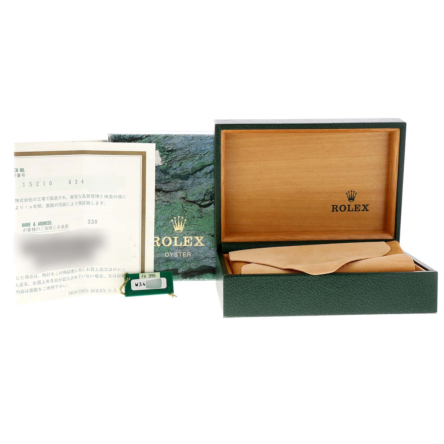 The image shows the packaging and accessories for a Rolex Date 15210 Men's Stainless Steel Blue Dial 15210 Men's Stainless Steel Blue Dial model, including the box, documents, and a tag.