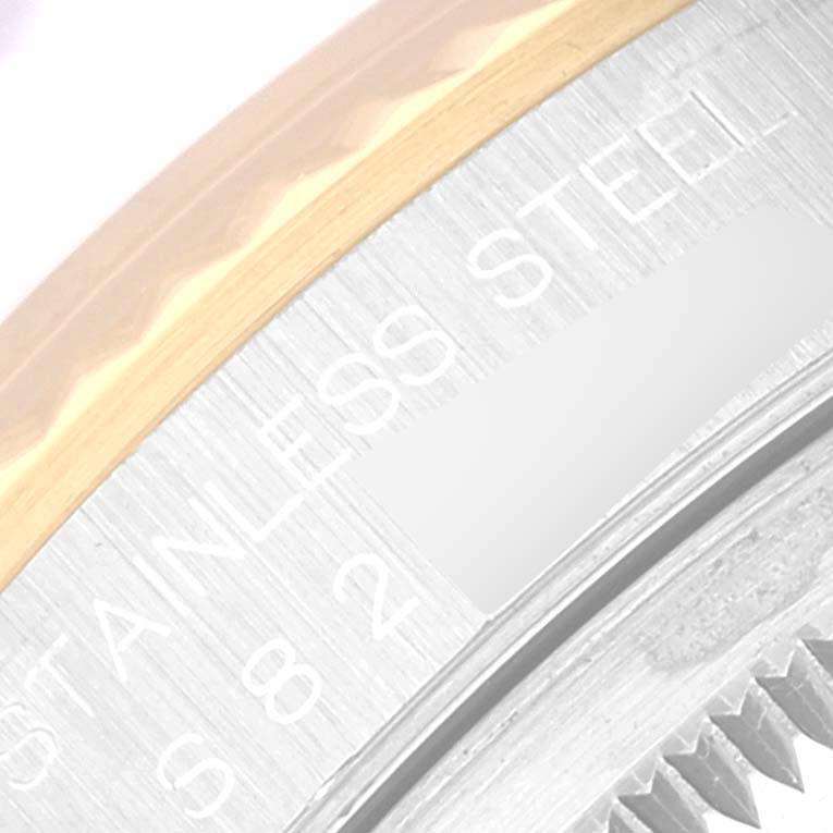 The image shows a partial close-up of the bezel and casing of a Rolex Datejust 16233 Men's Steel and Gold (two tone) Blue Dial 16233 Men's Steel and Gold (two tone) Blue Dial watch, highlighting the words "STAINLESS STEEL".