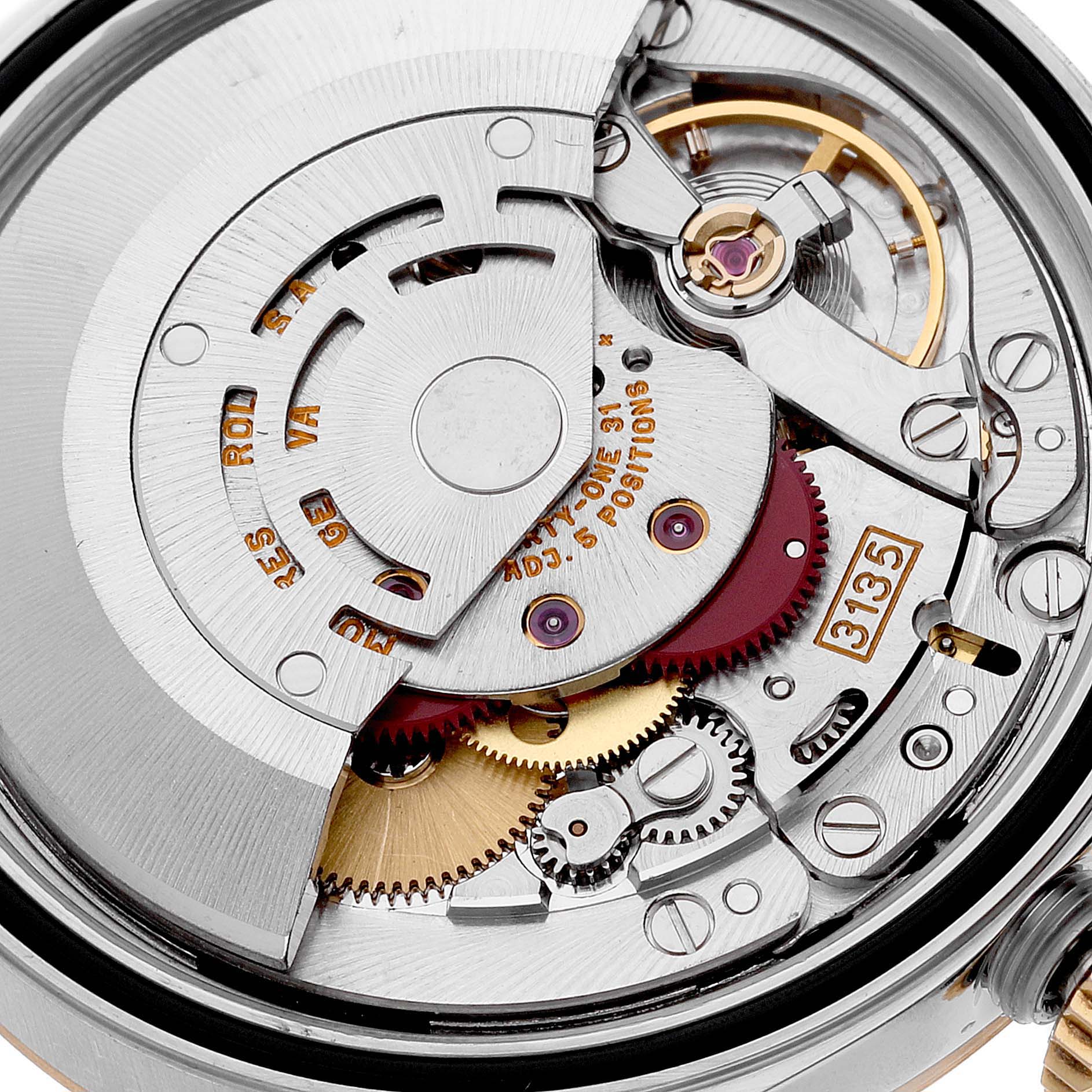 The image shows a close-up of the movement and internal components of a Rolex Datejust 16233 Men's Steel and Gold (two tone) Blue Dial 16233 Men's Steel and Gold (two tone) Blue Dial watch.