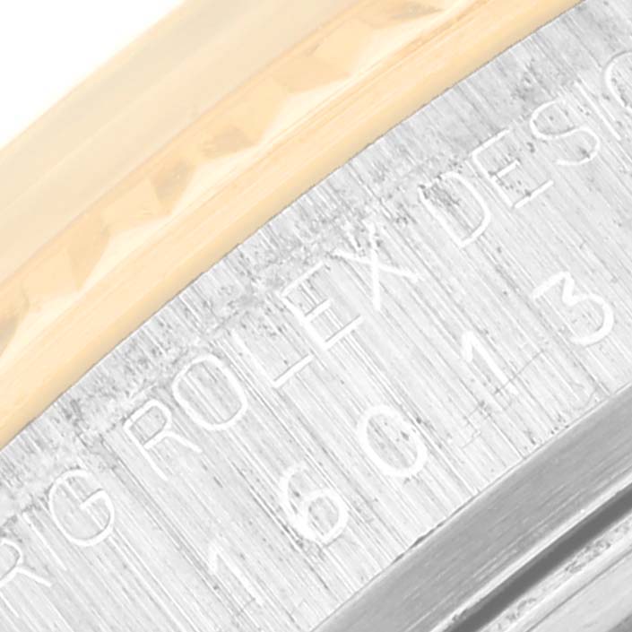 This close-up image shows the case and bezel with "Rolex" engraving on a Vintage Collection model by Rolex.