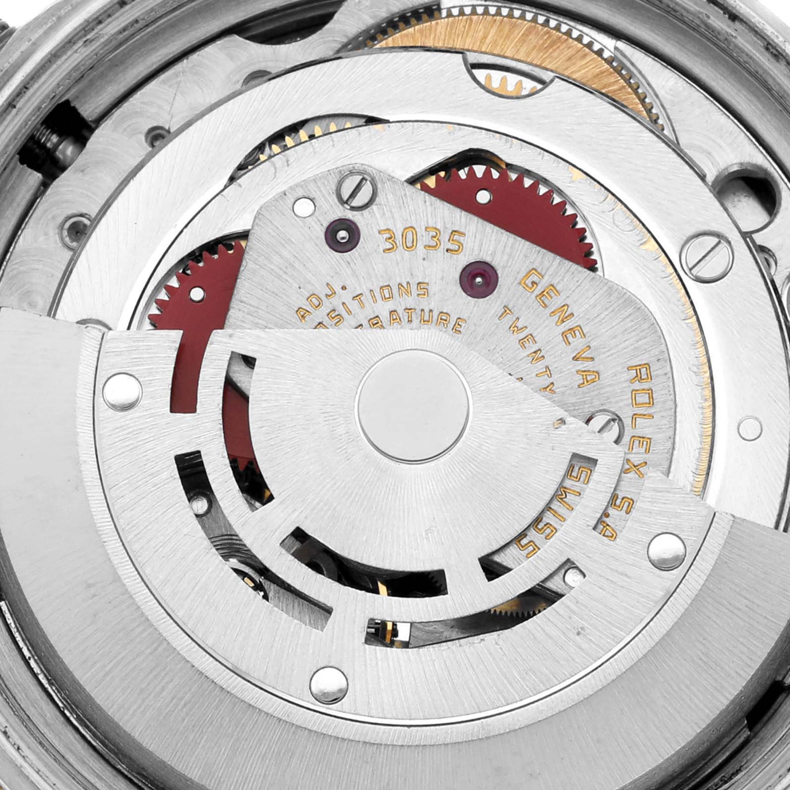 This close-up image shows the inner mechanical movement of a Rolex Vintage Collection 16013 Men's Steel and Gold (two tone) Champagne Dial 16013 Men's Steel and Gold (two tone) Champagne Dial model, featuring gears and inscriptions.