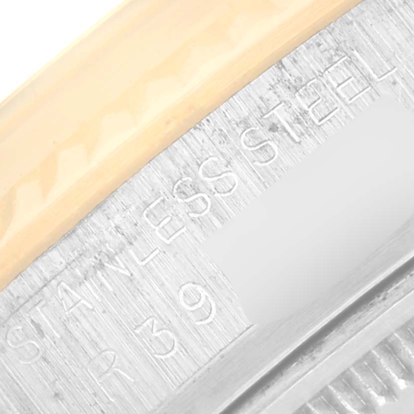 The image shows a close-up of the bezel and engraved markings on the case of a Rolex Vintage Collection 16013 Men's Steel and Gold (two tone) Champagne Dial 16013 Men's Steel and Gold (two tone) Champagne Dial watch.