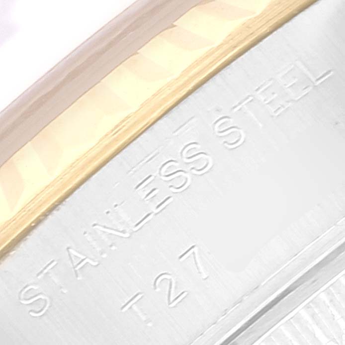 This close-up image shows the stainless steel casing and the edge of the bezel of the Rolex Datejust 69173 Women's Steel and Gold (two tone) Champagne Dial 69173 Women's Steel and Gold (two tone) Champagne Dial watch.