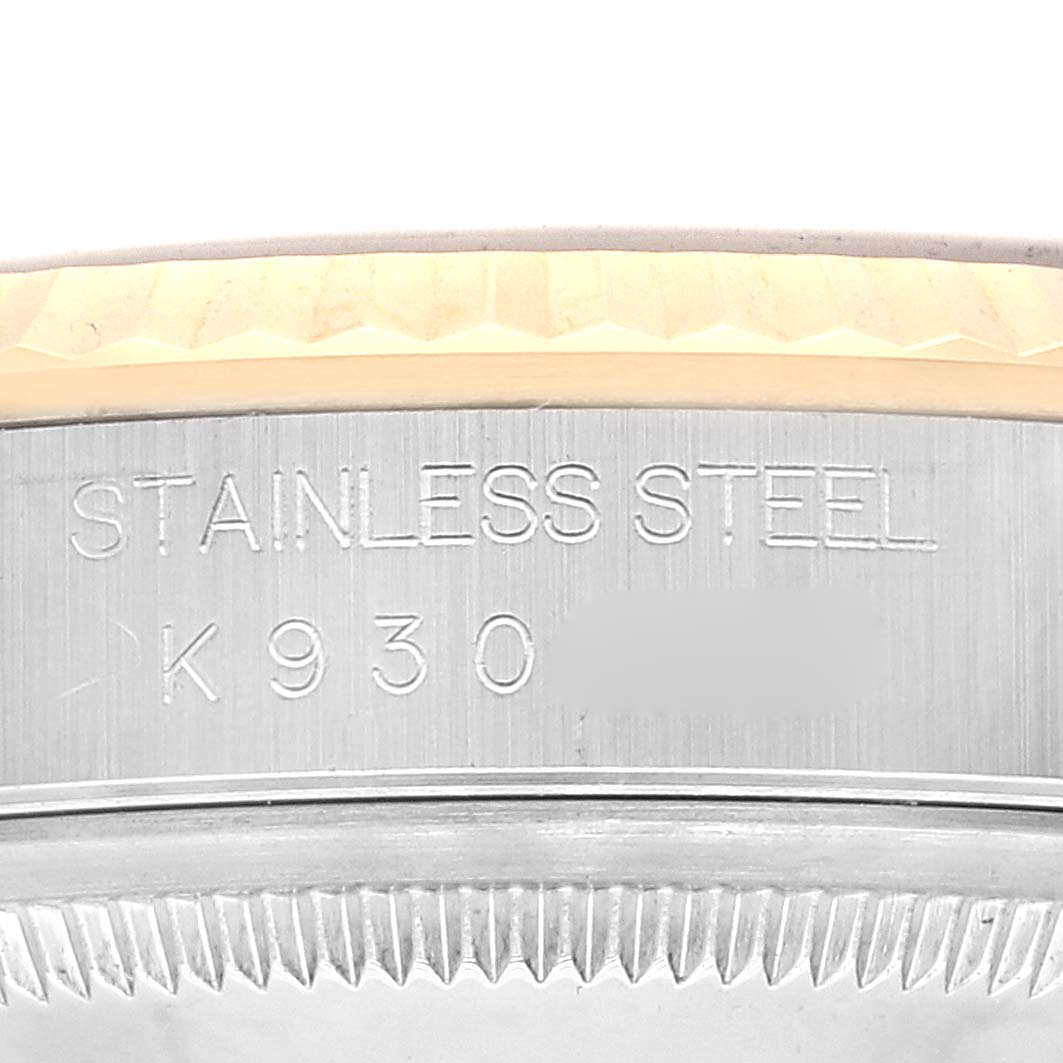 This image shows a close-up of the case back and bezel, with "STAINLESS STEEL" engraved, on a Rolex Datejust 16233 Men's Steel and Gold (two tone) Blue Dial 16233 Men's Steel and Gold (two tone) Blue Dial watch.