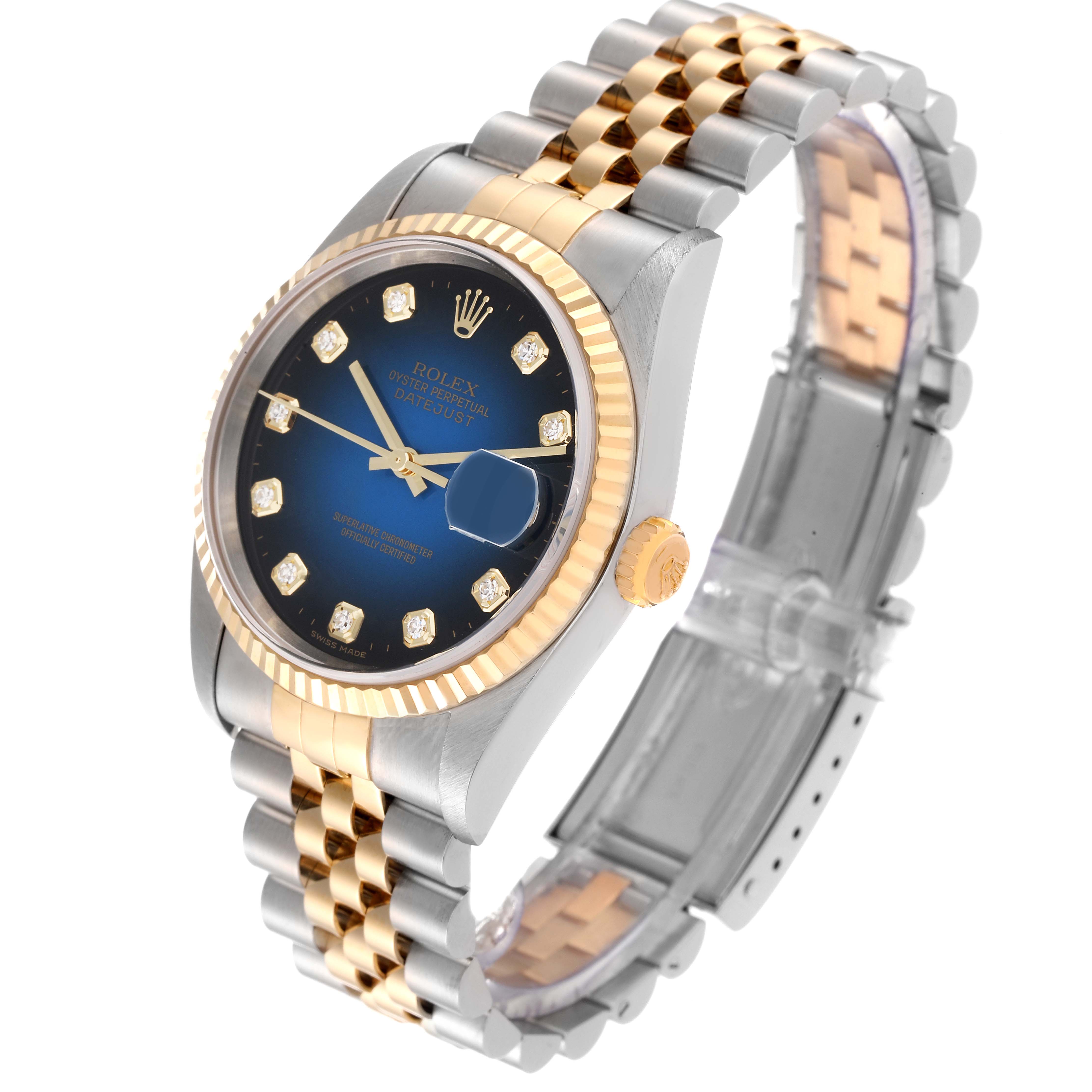 This Rolex Datejust 16233 Men's Steel and Gold (two tone) Blue Dial 16233 Men's Steel and Gold (two tone) Blue Dial watch is shown at an angle highlighting its blue dial, diamond hour markers, two-tone bracelet, and fluted bezel.