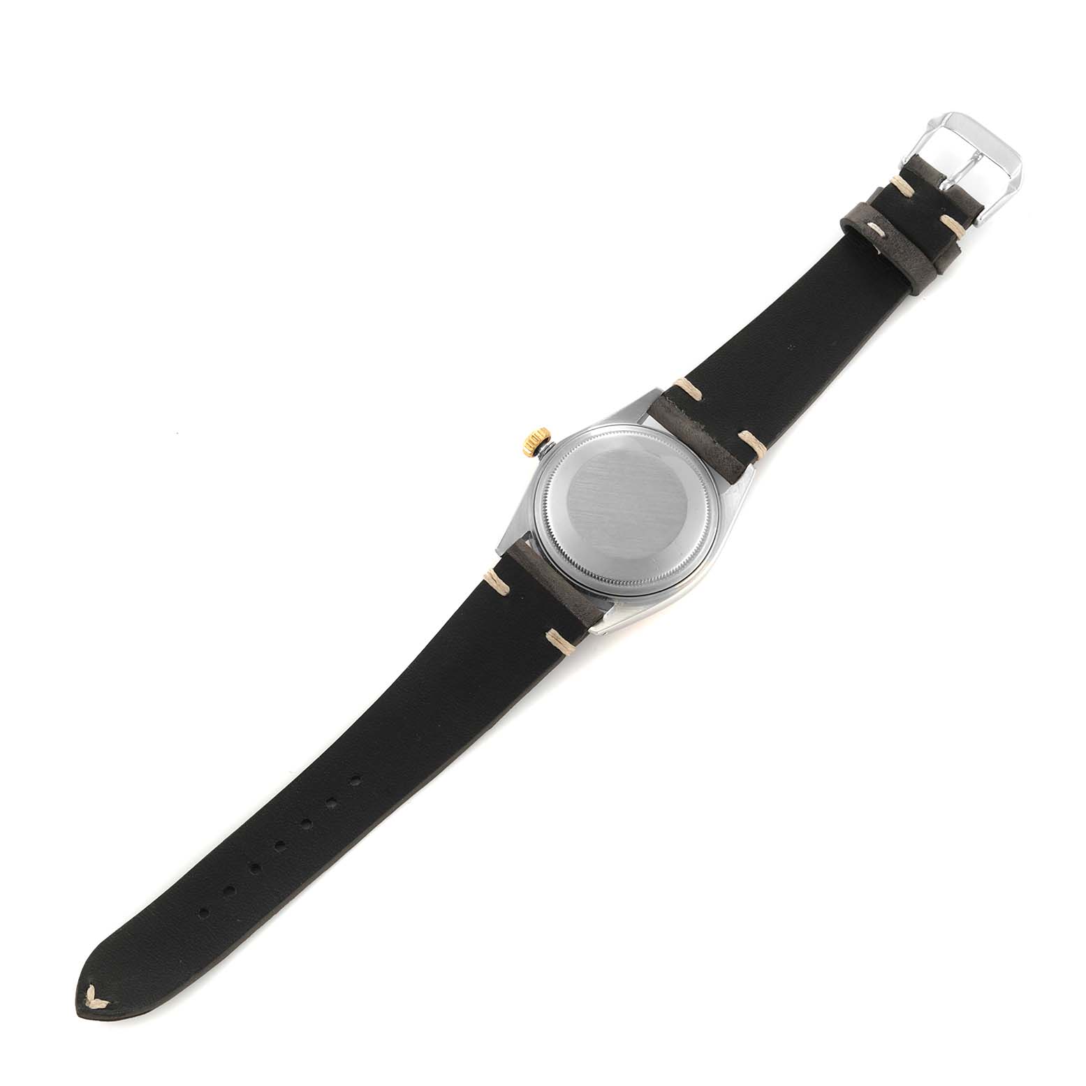 The image shows the back view of a Vintage Collection Rolex watch with a black leather strap and a metal buckle.