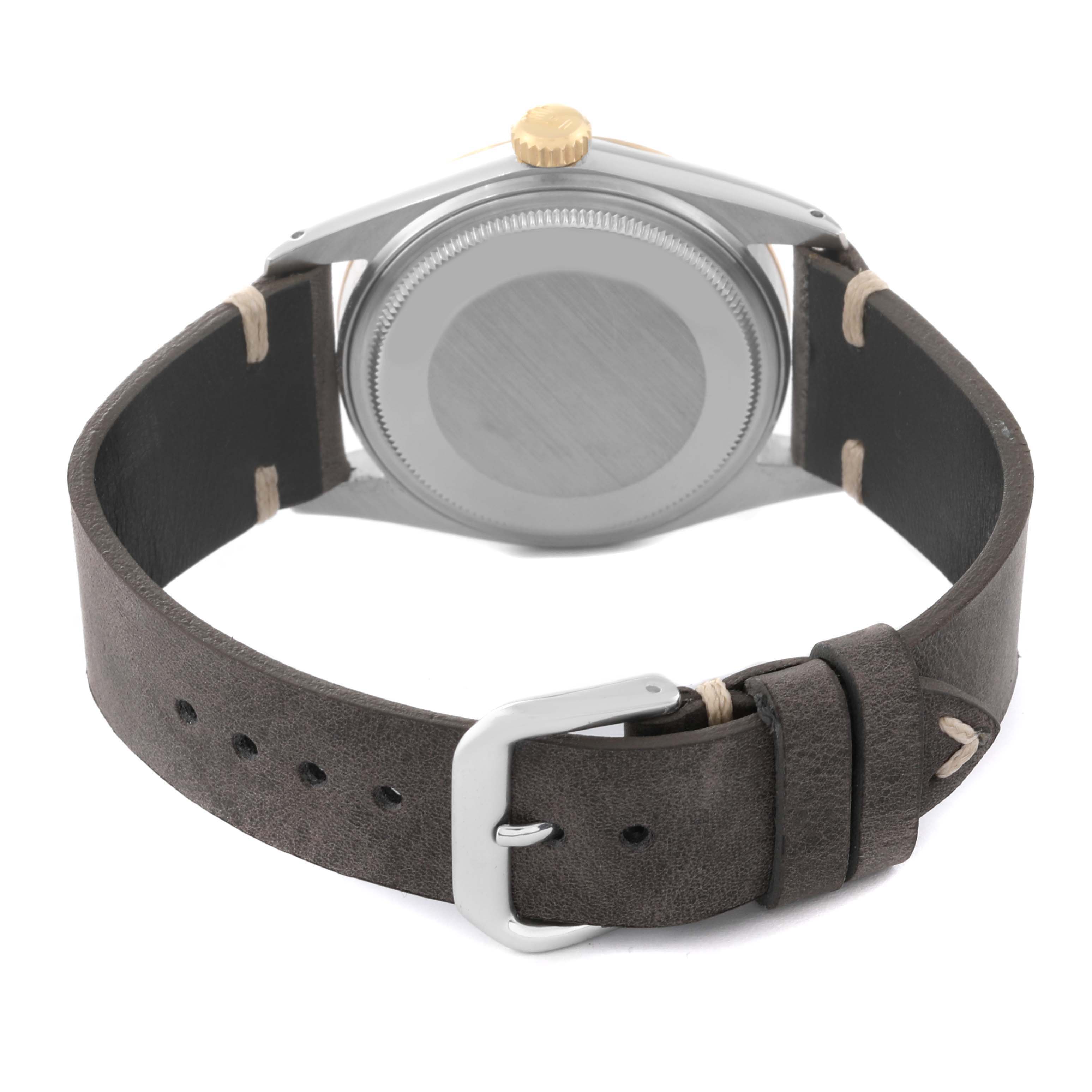 The image shows the back view of a Rolex Vintage Collection 16013 Men's Steel and Gold (two tone) Champagne Dial 16013 Men's Steel and Gold (two tone) Champagne Dial model watch, highlighting its case back and leather strap.