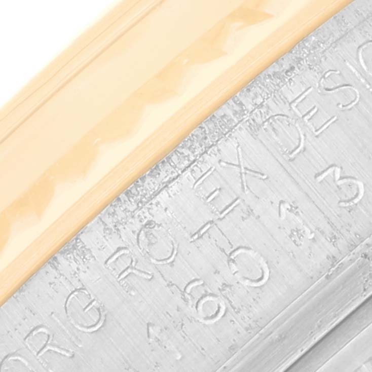 This close-up image shows the detailed engraving on the bezel of the Vintage Collection model by Rolex.