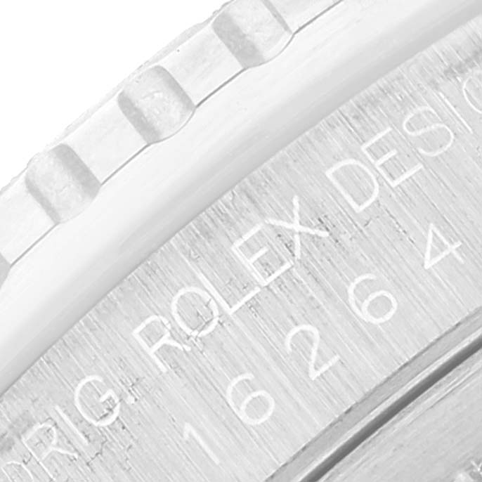 This close-up image shows the engraved edge and serial number of a Rolex Turn-o-Graph 16264 Men's Stainless Steel White Dial 16264 Men's Stainless Steel White Dial watch.