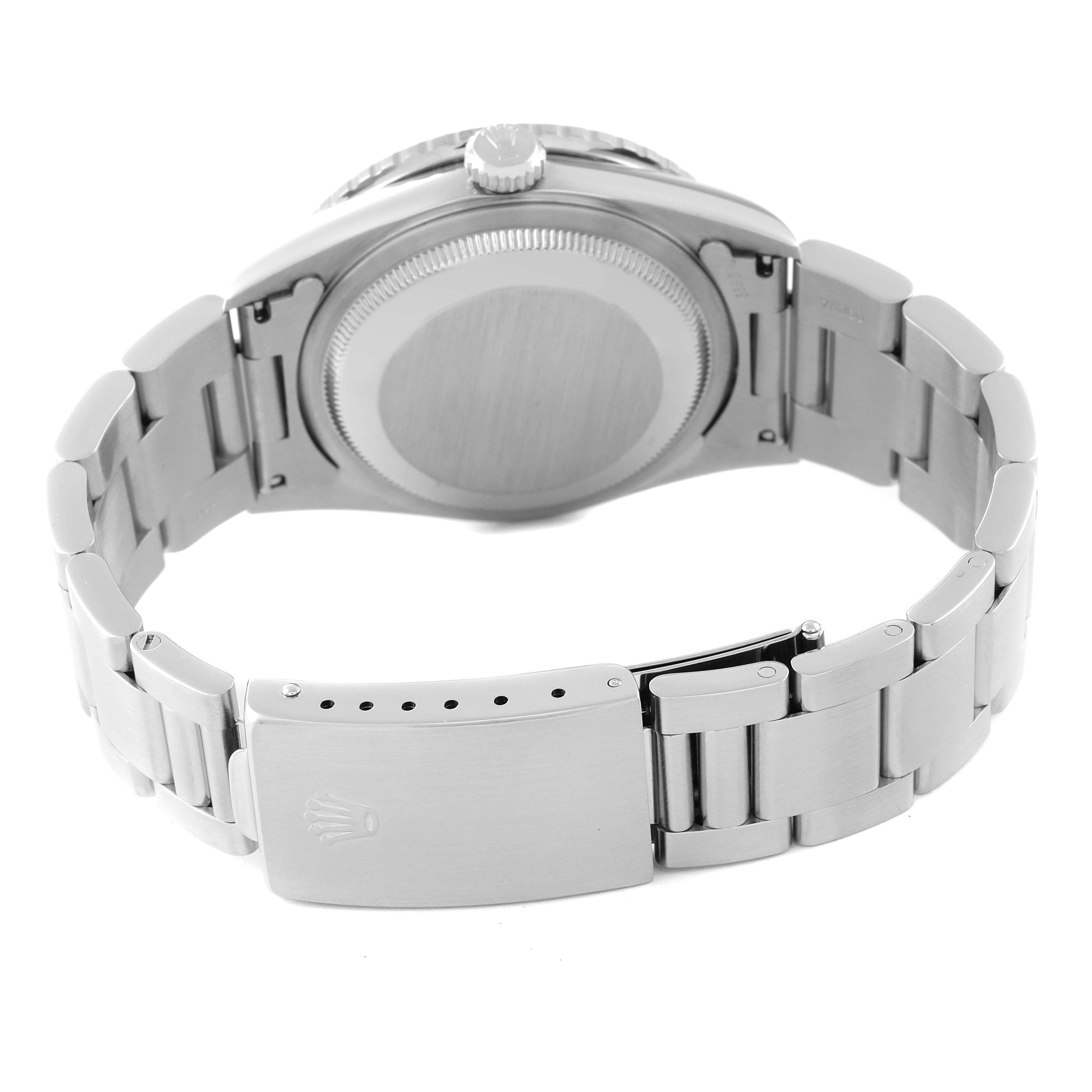 The image shows the back view of the Turn-o-Graph model by Rolex, highlighting the clasp, bracelet, and case back.